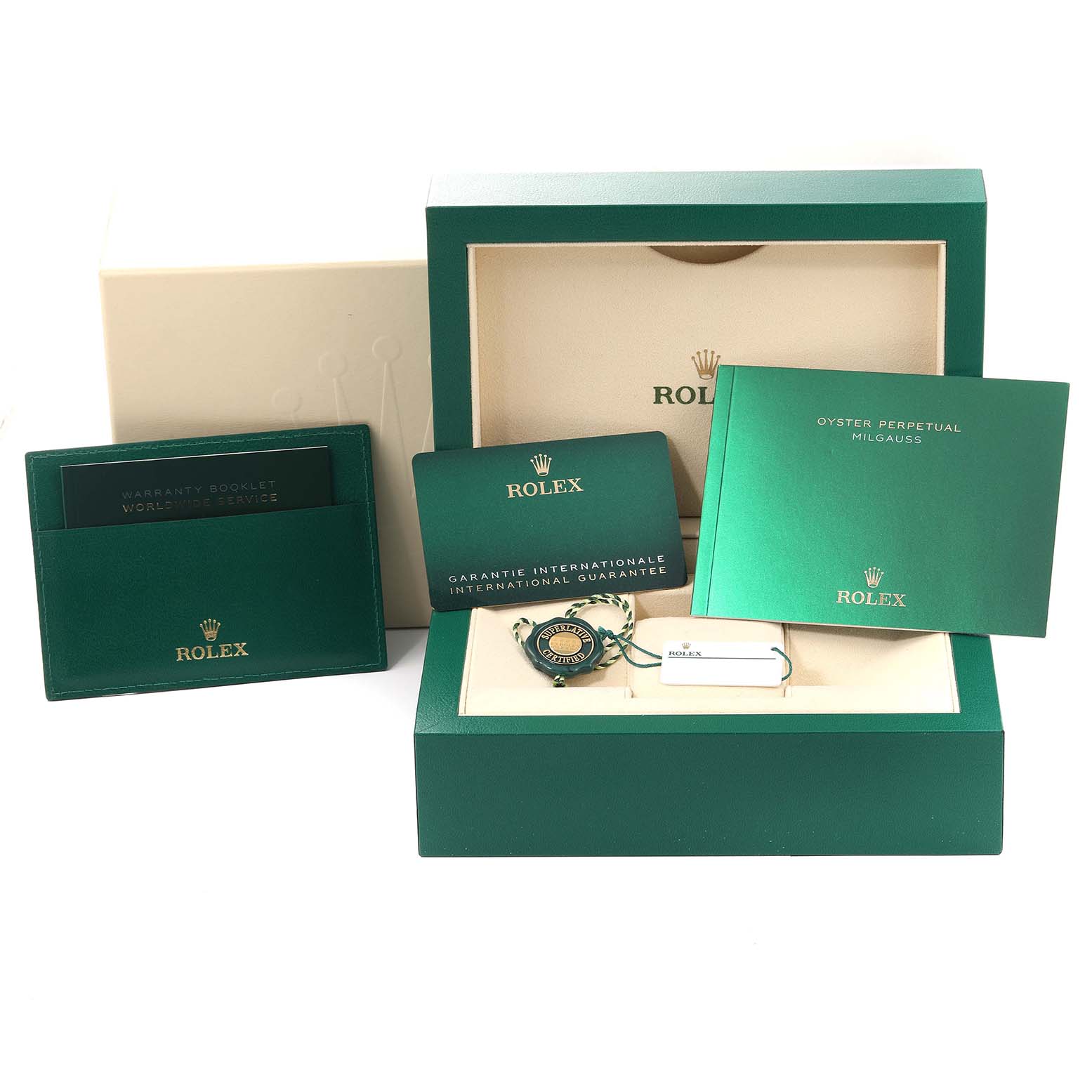 This image shows the accessories for a Rolex Milgauss 116400GV Men's Stainless Steel Black Dial 116400GV Men's Stainless Steel Black Dial, including its box, warranty card, booklet, and tags from a front angle.
