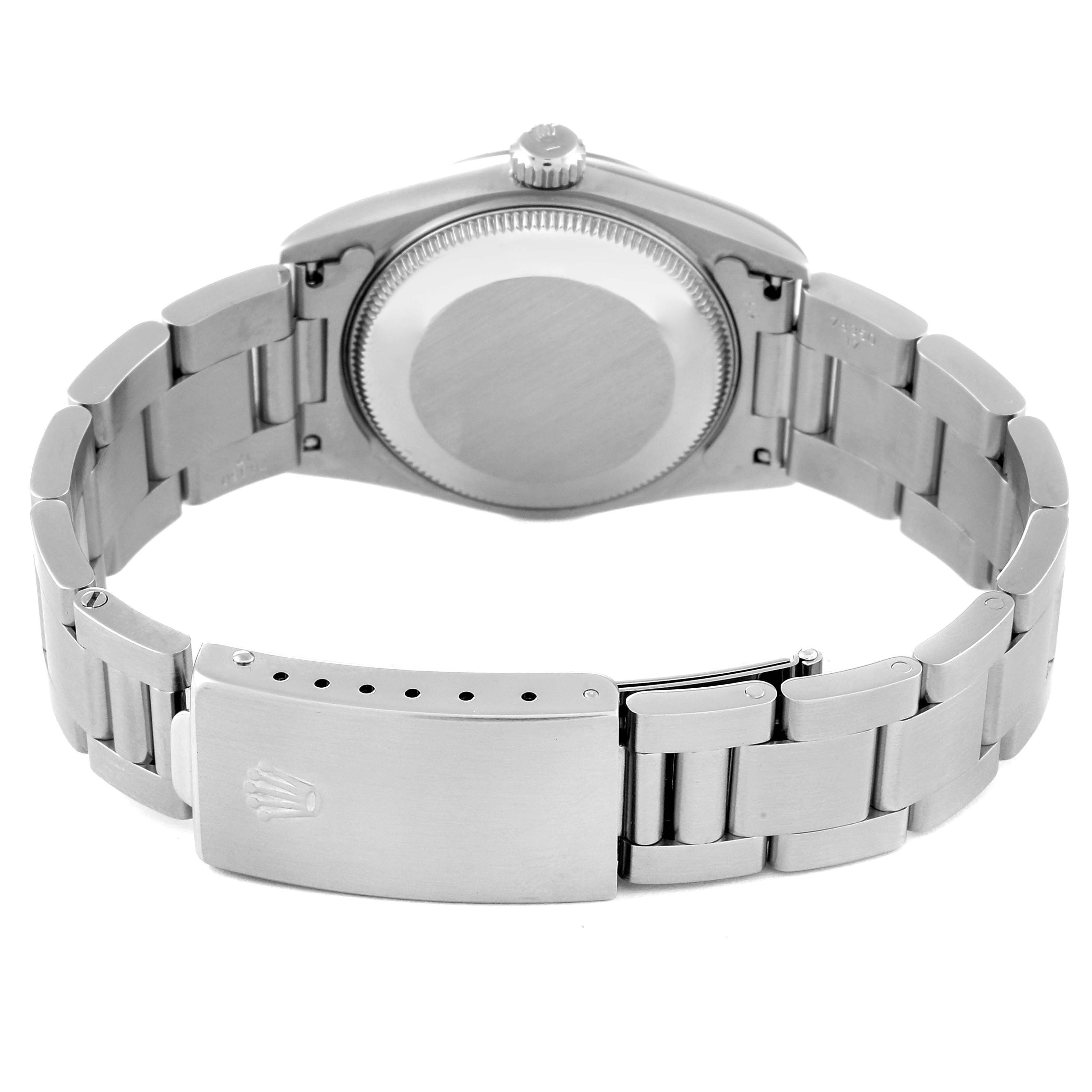 The image shows the back and clasp of a Rolex Mid-Size 67480 Women
s Stainless Steel Pink Dial 67480 Women
s Stainless Steel Pink Dial model watch, highlighting its bracelet and case back.