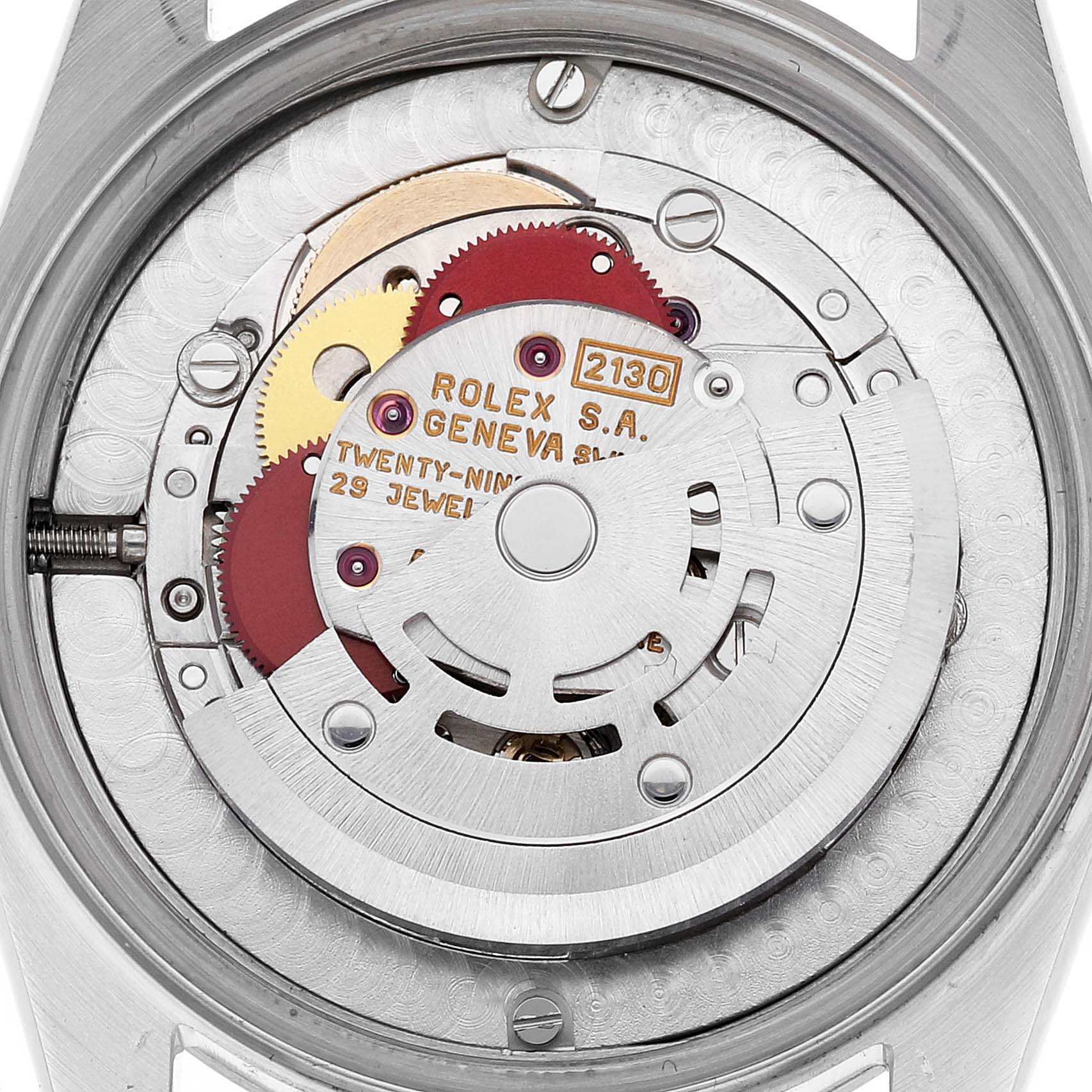 This image shows the open case back and movement of a Rolex Mid-Size 67480 Women
s Stainless Steel Pink Dial 67480 Women
s Stainless Steel Pink Dial model, focusing on its internal components.