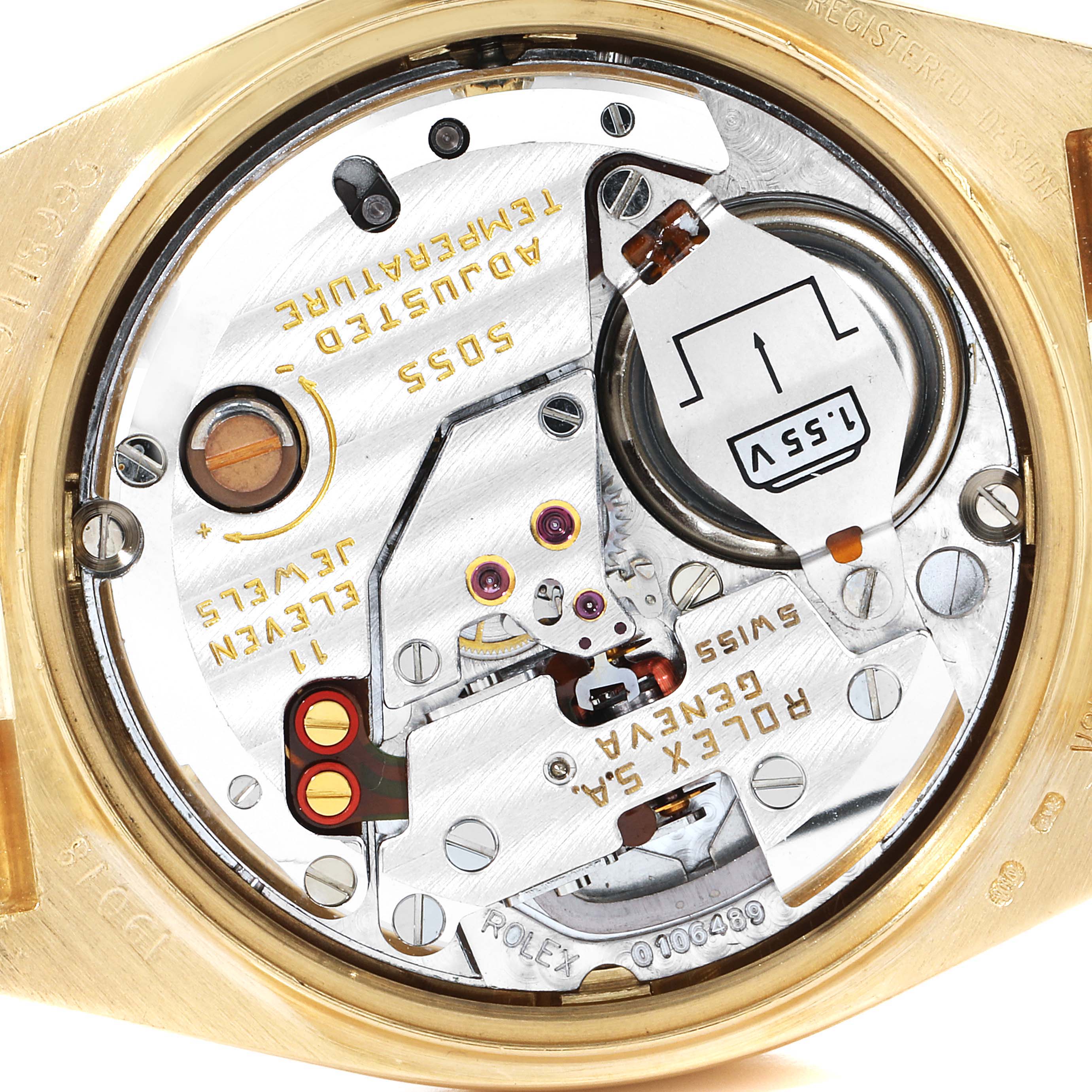 The image shows the internal movement of a Rolex Oysterquartz 19018 Men's Yellow Gold Champagne Dial 19018 Men's Yellow Gold Champagne Dial watch, specifically showcasing the battery and various mechanisms.