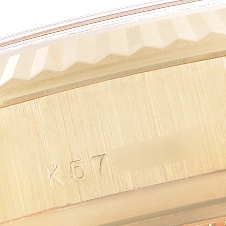 This image shows a close-up of the bezel and part of the case back of a Rolex President 179238 Women
s Yellow Gold White Dial 179238 Women
s Yellow Gold White Dial model.