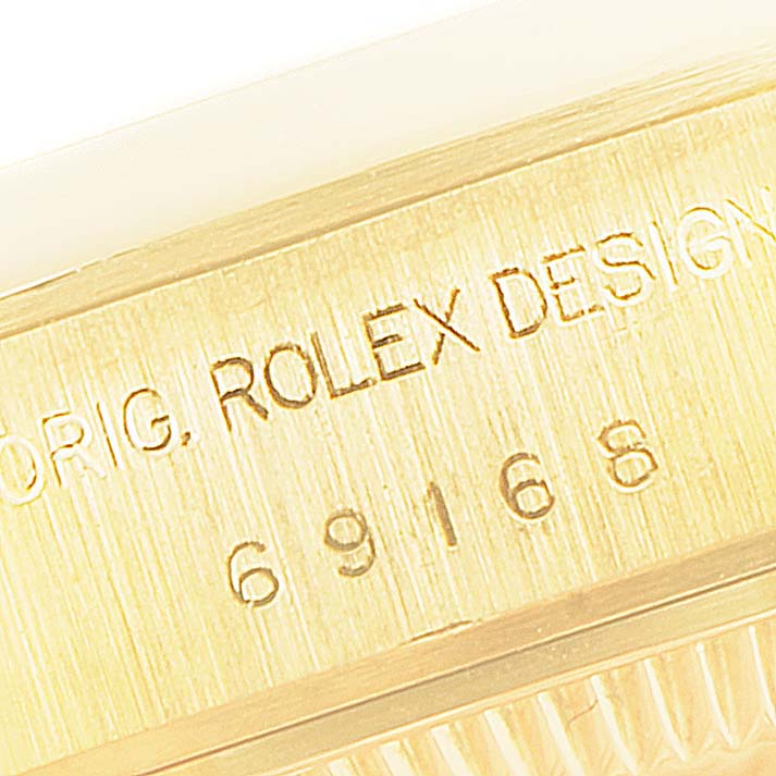 This close-up image shows the engraving on the side of the Rolex President 69168 Women
s Yellow Gold Champagne Dial 69168 Women
s Yellow Gold Champagne Dial model watch case.