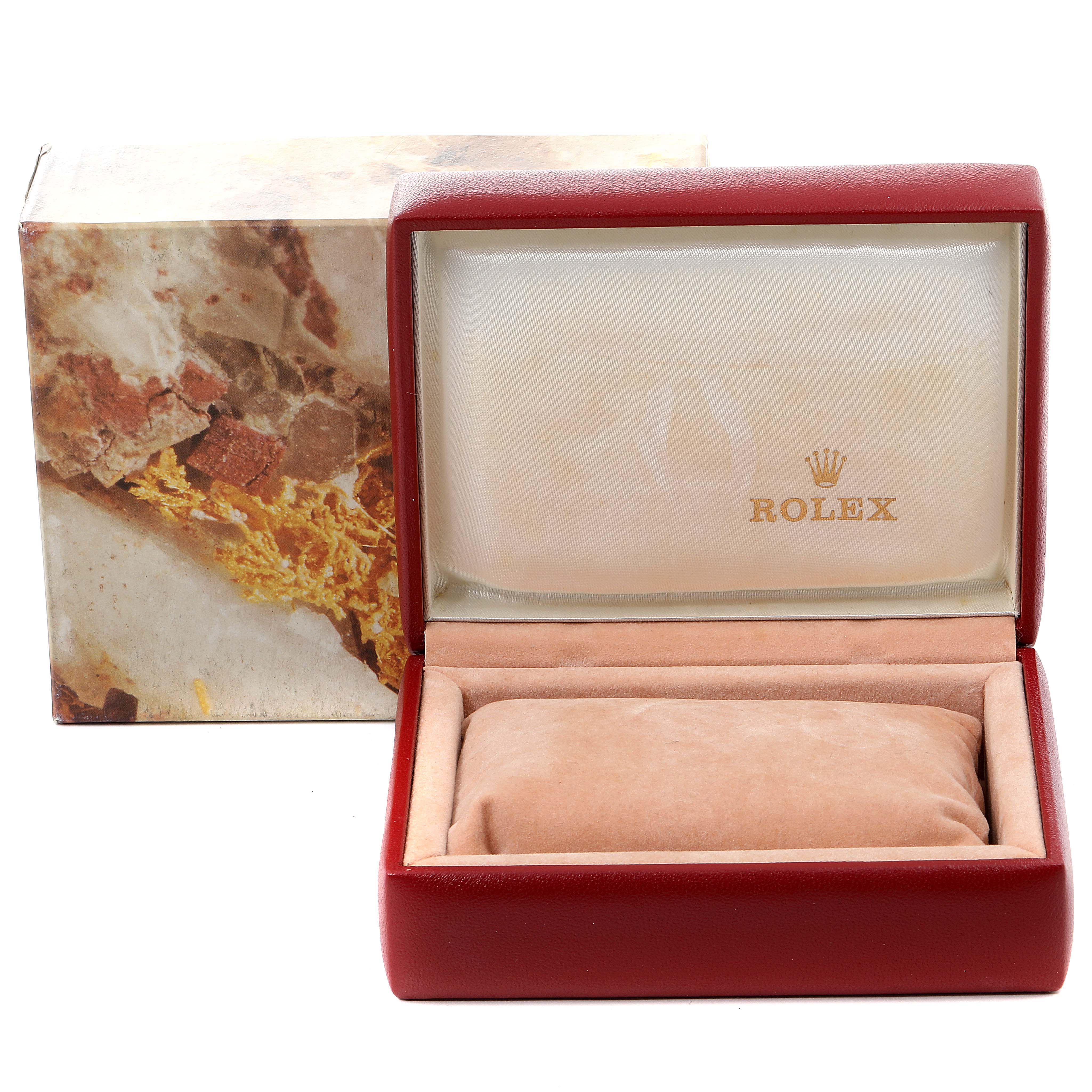 The image shows an open Rolex watch box for the President model with a cushion and branding inside.
