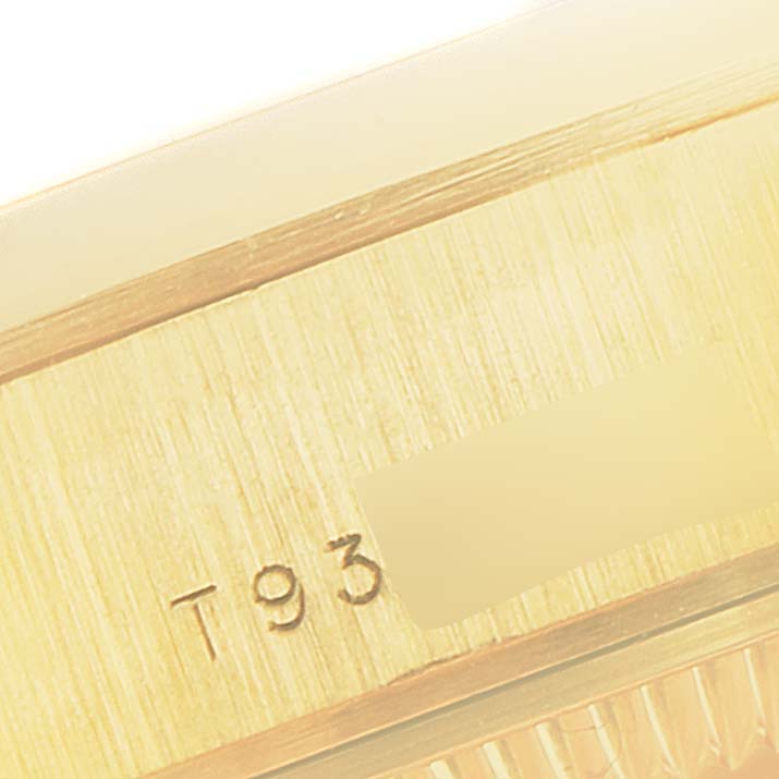 This close-up image shows the engraved serial number on the side of the case of a Rolex President 69168 Women
s Yellow Gold Champagne Dial 69168 Women
s Yellow Gold Champagne Dial model watch.