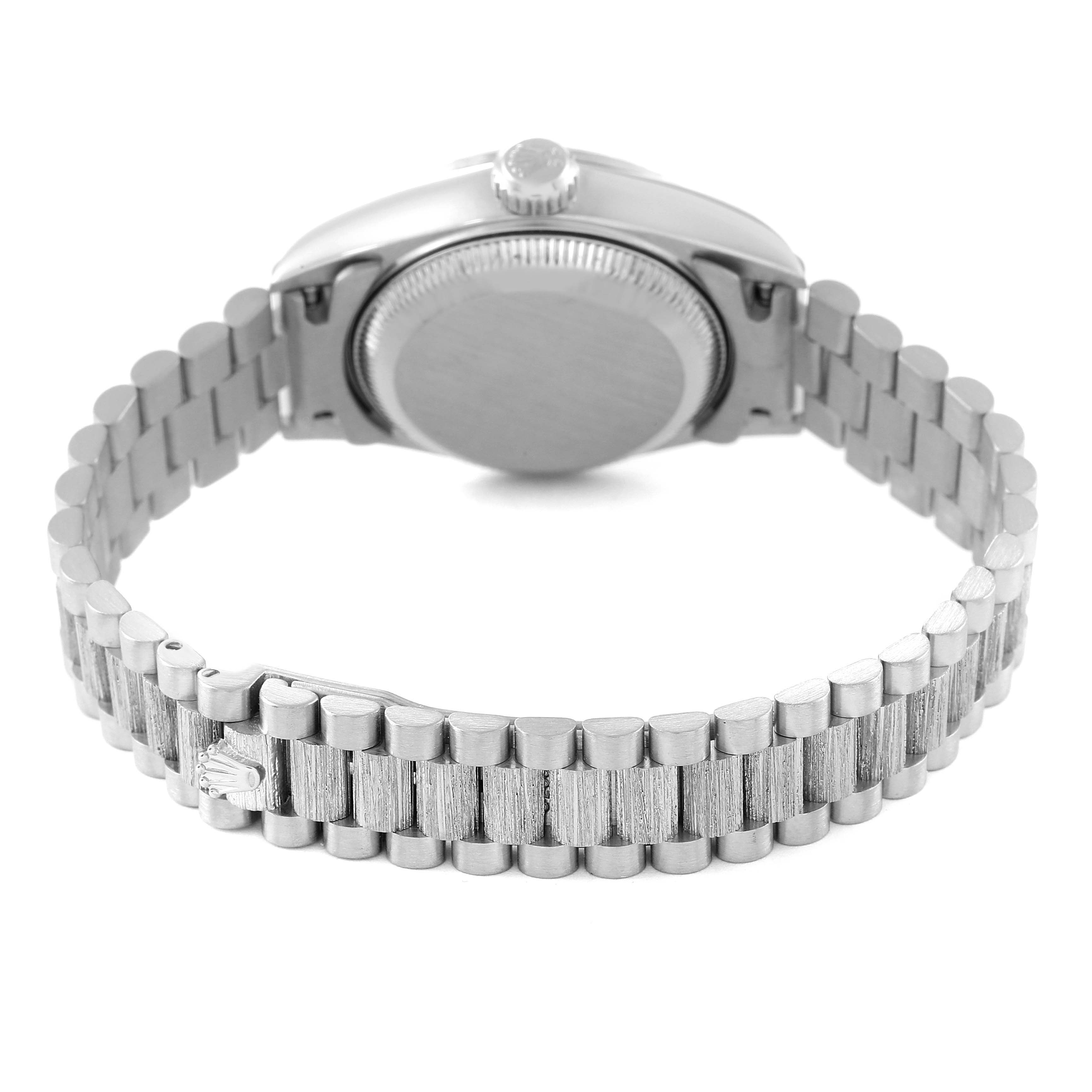 The image displays the case back and bracelet of a Rolex President 79279 Women's White Gold Pink Dial 79279 Women's White Gold Pink Dial model watch from a rear angle.