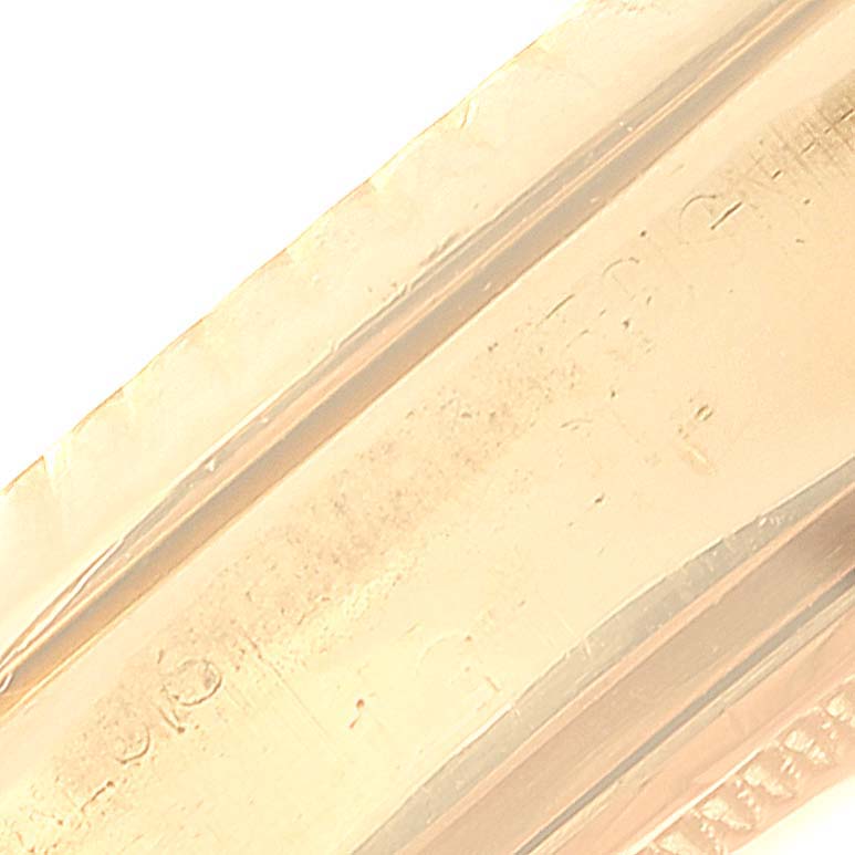 This is a close-up shot of the bracelet link of a Rolex President 1803 Men's Yellow Gold Black Dial 1803 Men's Yellow Gold Black Dial model watch.