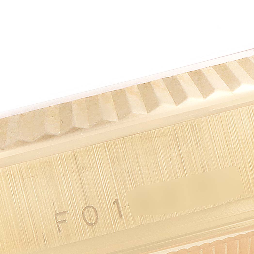 This image shows a close-up of the fluted bezel and case part of the Rolex President 118238 Men's Yellow Gold Champagne Dial 118238 Men's Yellow Gold Champagne Dial watch model.