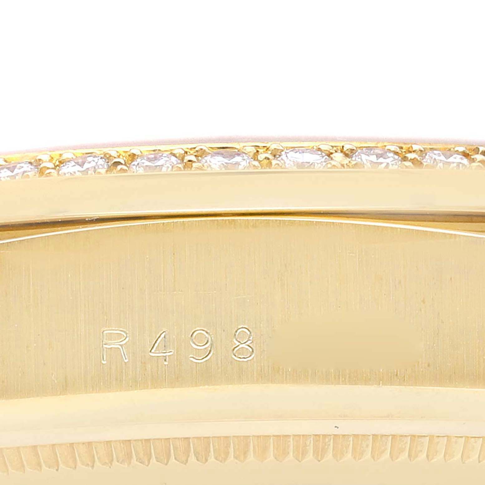 This image shows a close-up of the bezel with diamonds and the engraved model number of a Rolex President 18048 Men
s Yellow Gold Champagne Dial 18048 Men
s Yellow Gold Champagne Dial watch.