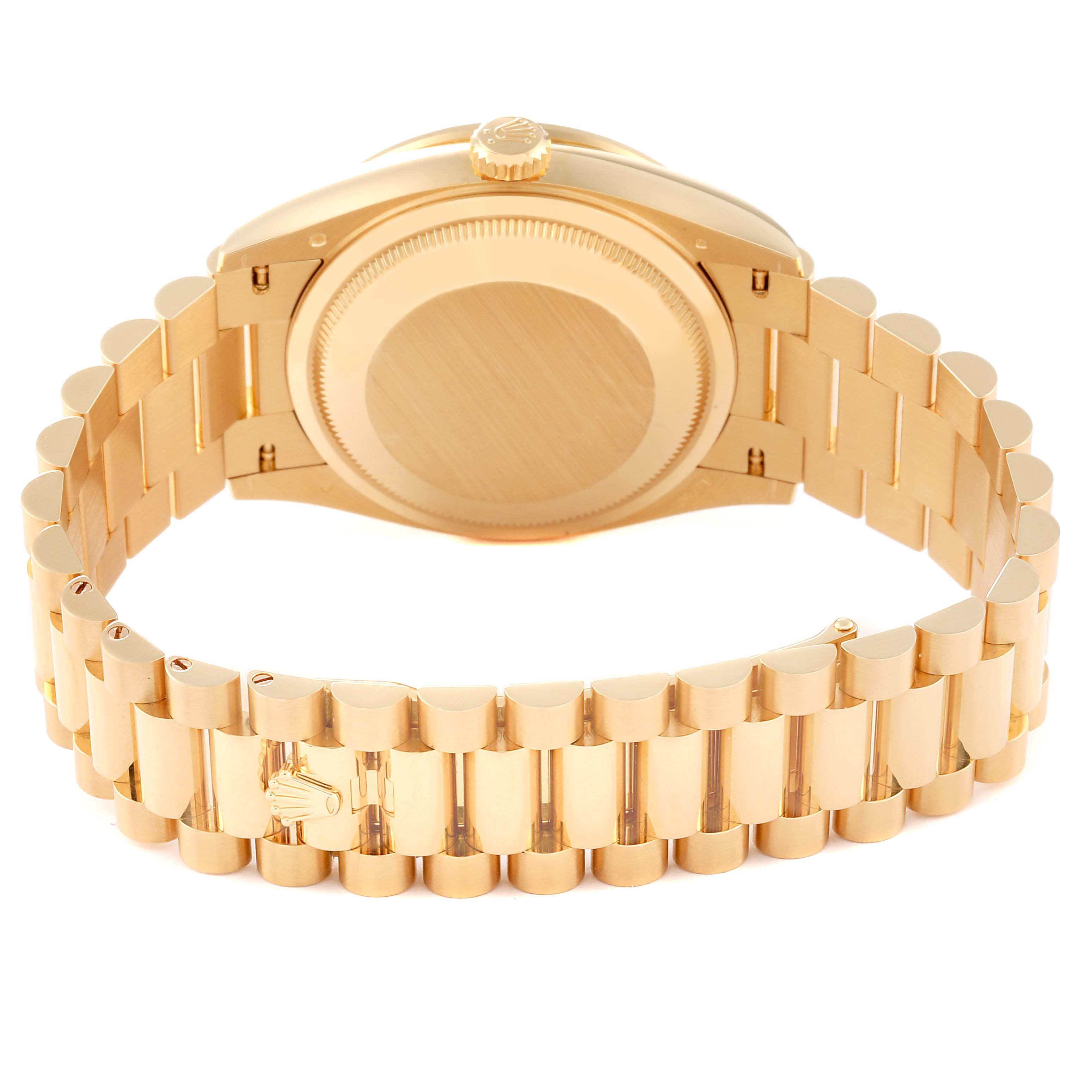 This image shows the back view of a Rolex President 128348RBR Men's Yellow Gold Green Dial 128348RBR Men's Yellow Gold Green Dial model watch, highlighting its case back and President bracelet.