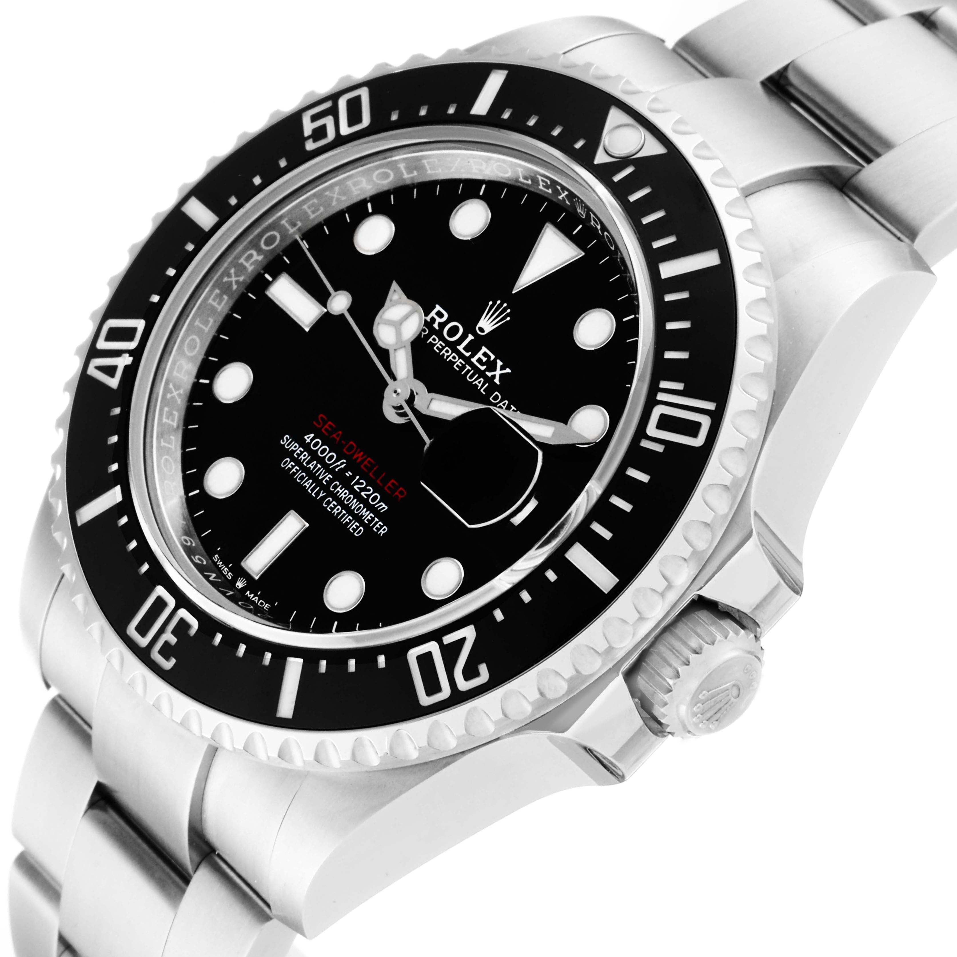 The image shows a close-up angle of the Rolex Sea-Dweller 126600 Men
s Stainless Steel Black Dial 126600 Men
s Stainless Steel Black Dial watch, highlighting the dial, bezel, and part of the bracelet.