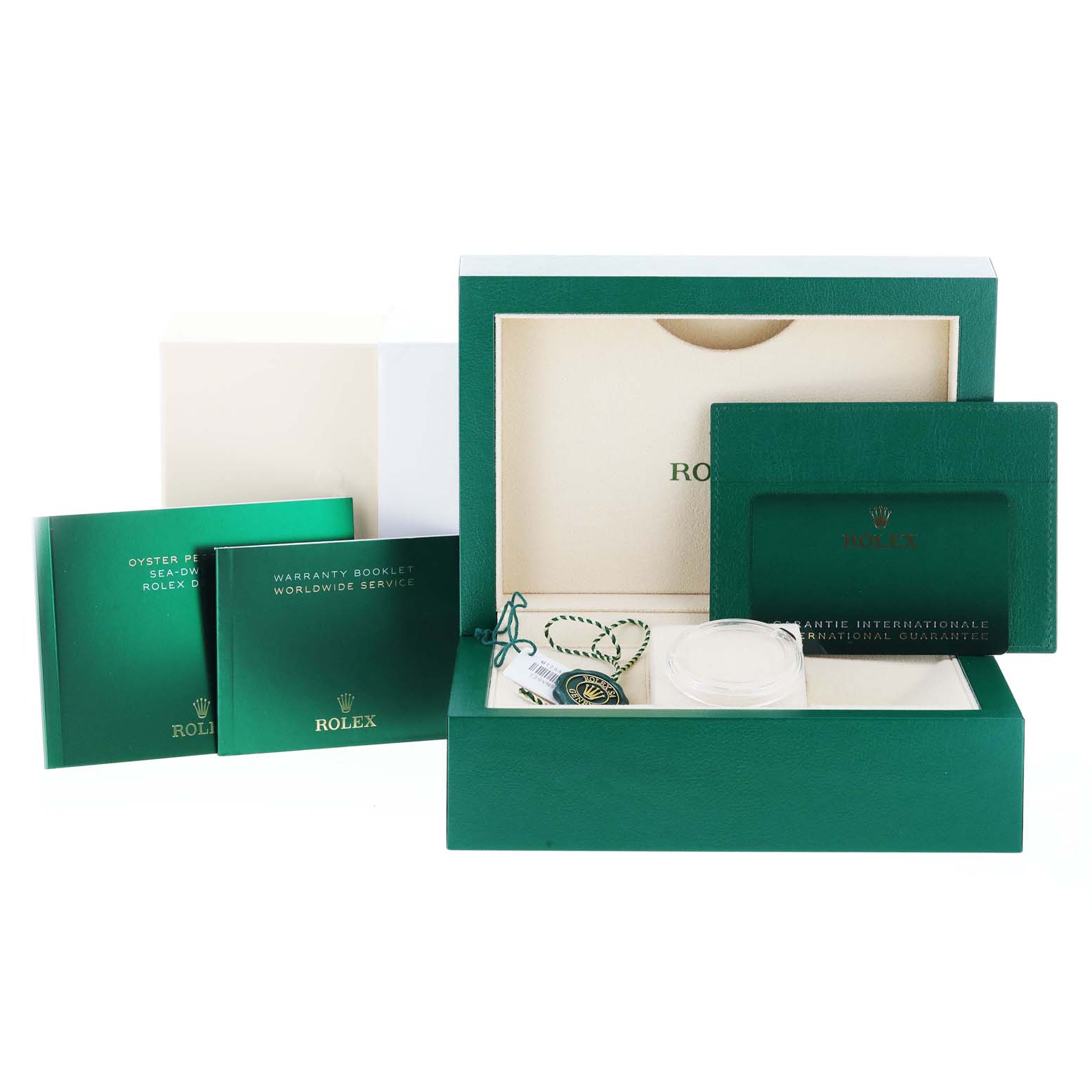 This image shows the packaging and accessories of a Rolex Sea-Dweller 126600 Men
s Stainless Steel Black Dial 126600 Men
s Stainless Steel Black Dial watch, including the box, booklets, and tags.