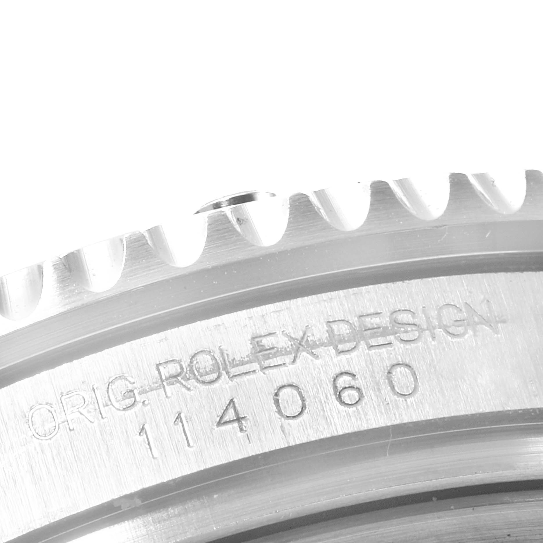 This image shows a close-up of the engraved serial and model number on the side of the case for a Rolex Submariner 114060 Men
s Stainless Steel Black Dial 114060 Men
s Stainless Steel Black Dial model.