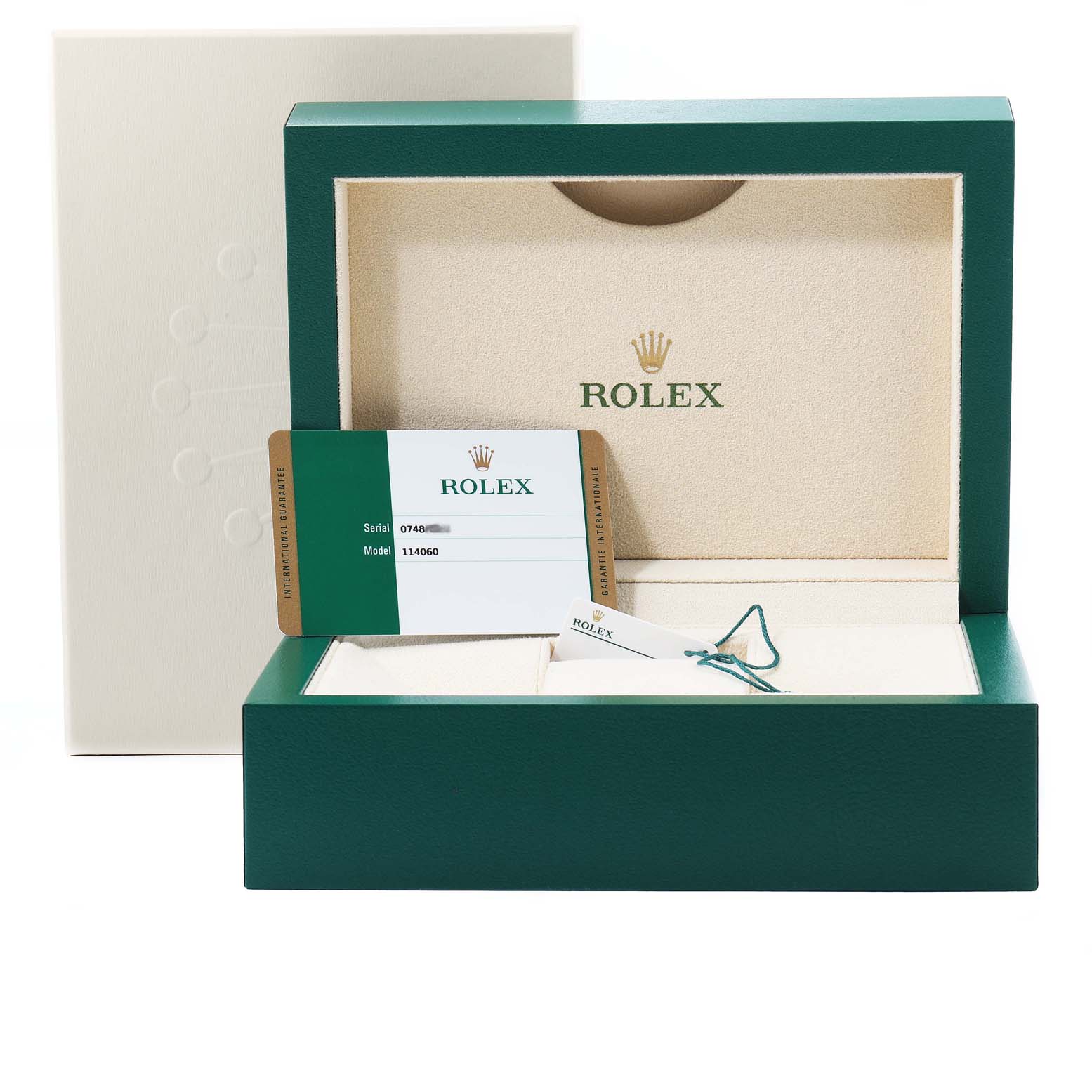 The image shows the packaging of a Rolex Submariner 114060 Men
s Stainless Steel Black Dial 114060 Men
s Stainless Steel Black Dial model, including the box, a card, and tags.