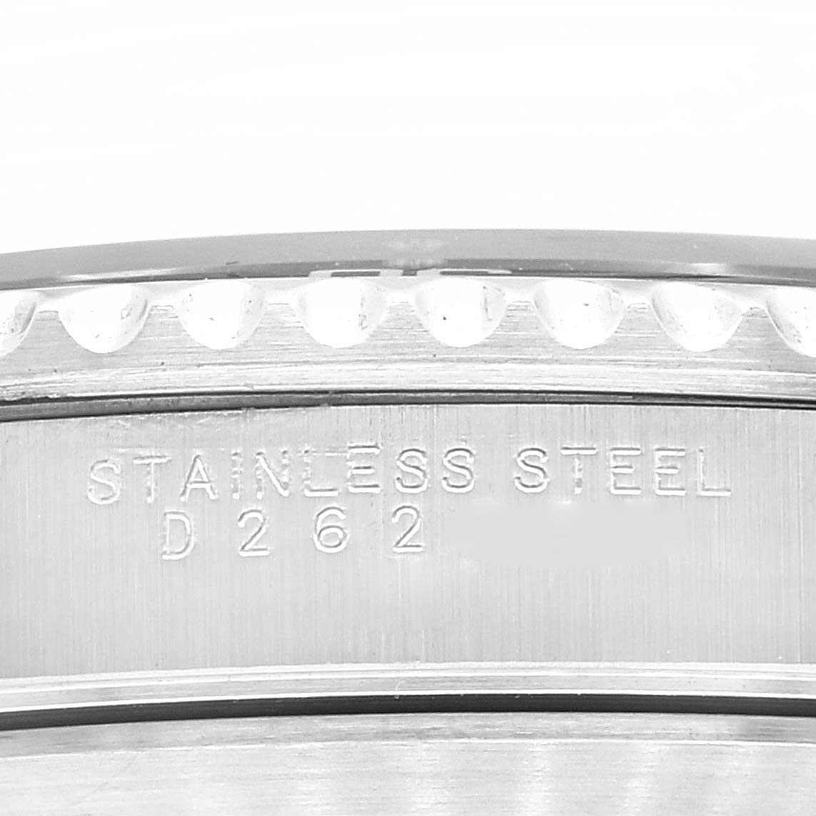 The image shows a close-up angle of the side of a Rolex Submariner 14060M Men's Stainless Steel Black Dial 14060M Men's Stainless Steel Black Dial, featuring the stainless steel marking and partial bezel.