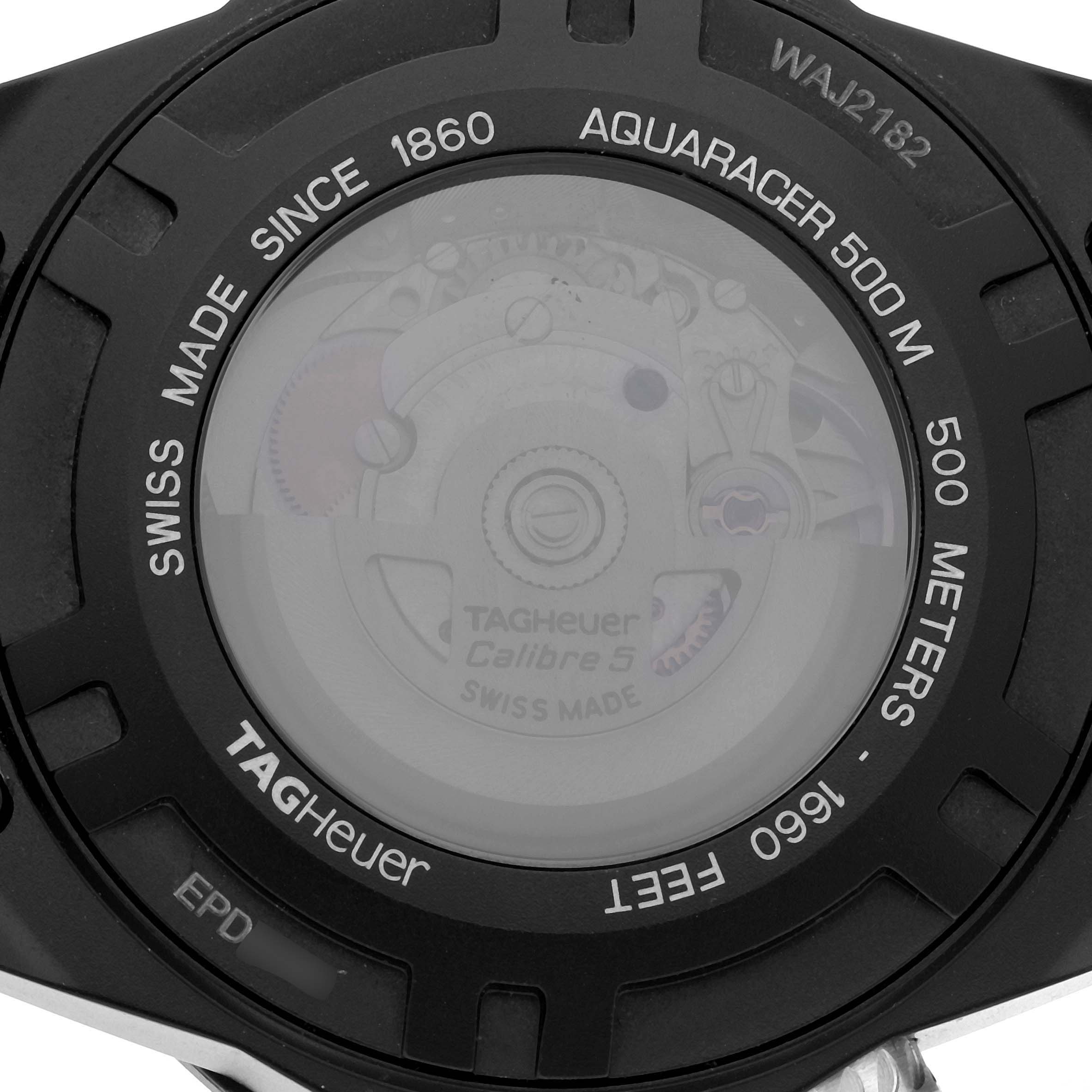 The image shows the back of a Tag Heuer Aquaracer WAJ2182 Men
s Titanium Black Dial WAJ2182 Men
s Titanium Black Dial watch, highlighting its Calibre 5 movement and 500-meter water resistance.