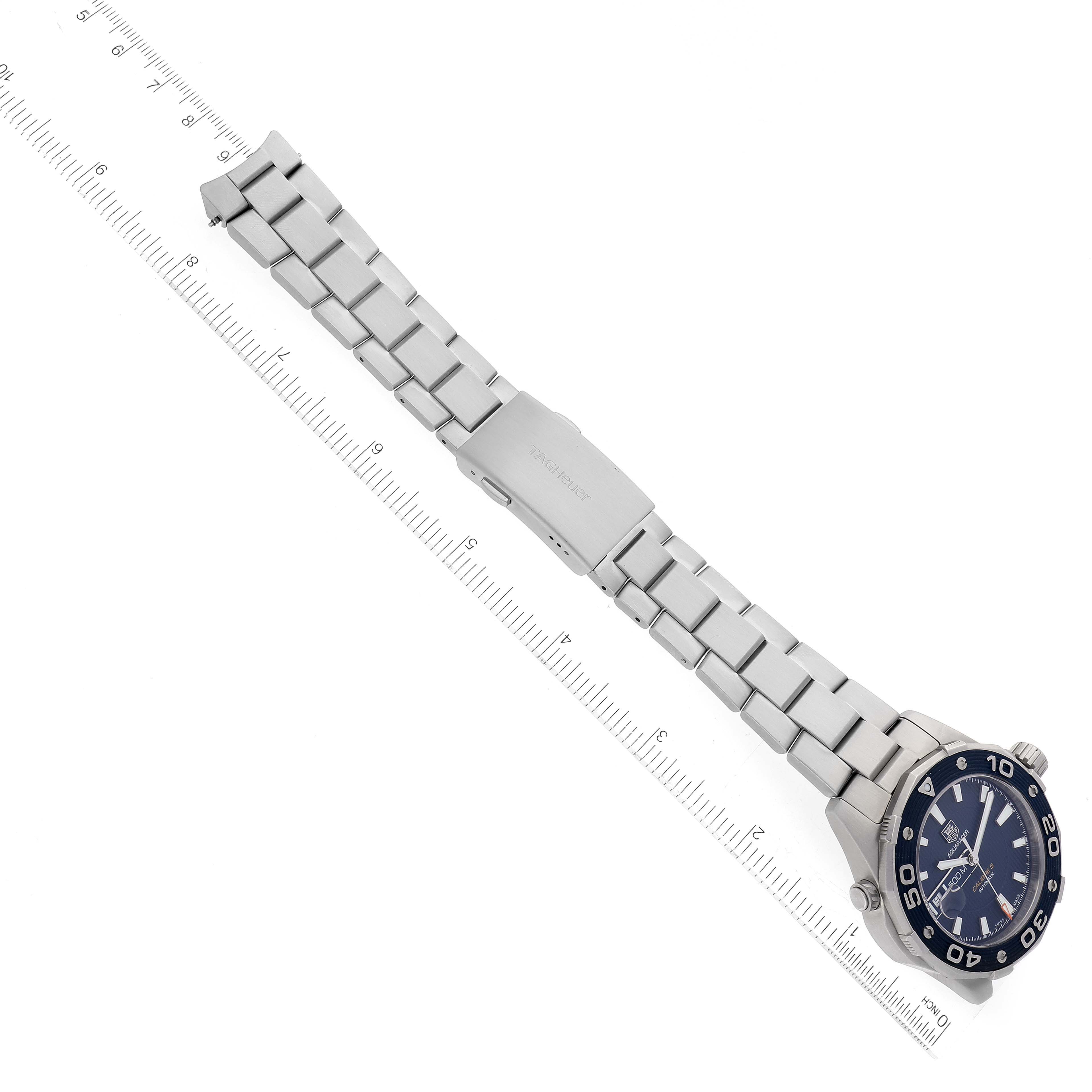 The image shows a Tag Heuer Aquaracer WAJ2112 Men's Stainless Steel Blue Dial WAJ2112 Men's Stainless Steel Blue Dial watch shot from above, displaying the full length and the metal bracelet with a clasp.