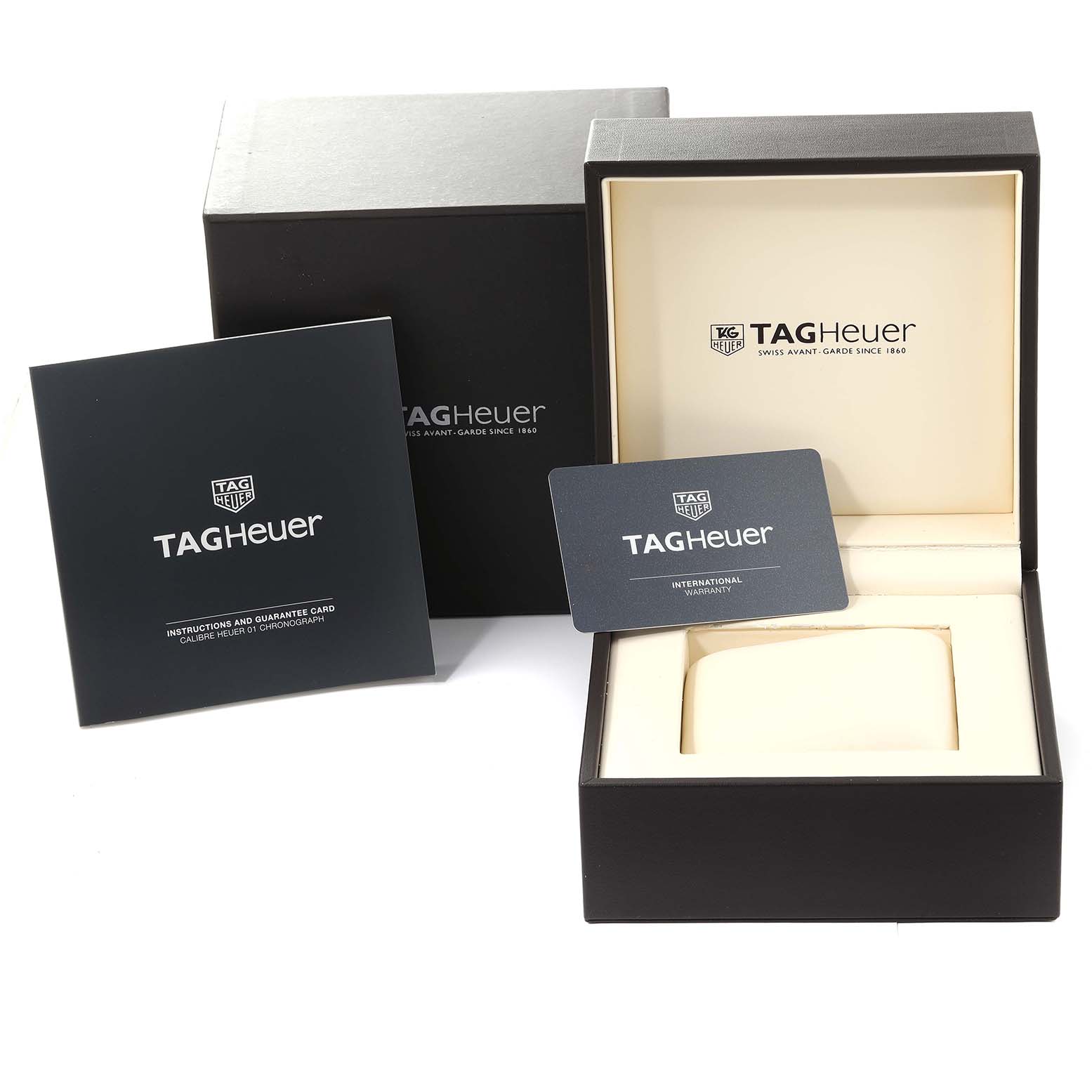 The image shows the Tag Heuer Carrera CAR2A8A.BF0707 Men's Titanium Grey Dial CAR2A8A.BF0707 Men's Titanium Grey Dial watch box with its instruction manual and international warranty card.