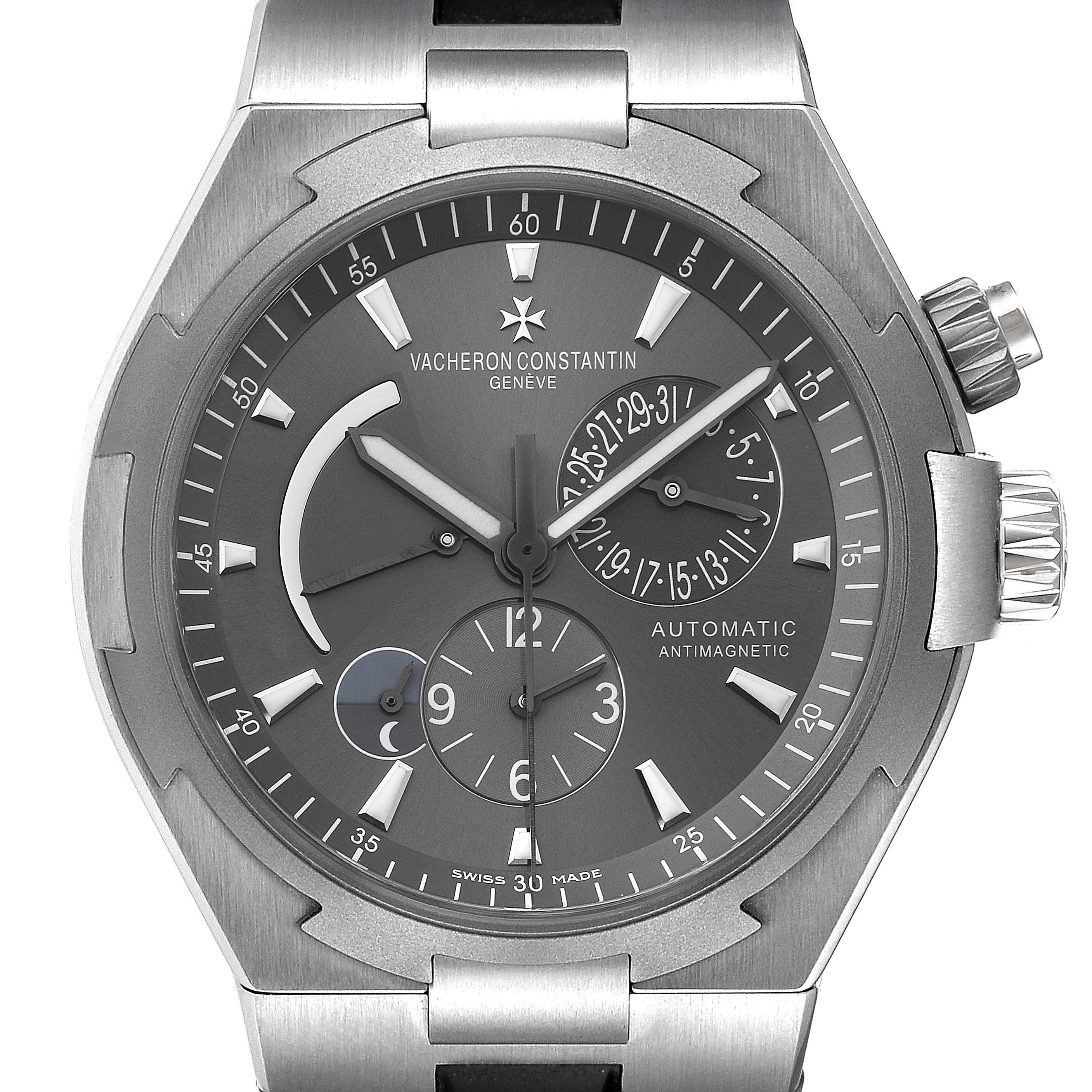 This image shows a close-up of the dial and crown of a Vacheron Constantin Overseas 47450/000W-9511 Men's Stainless Steel Black Dial 47450/000W-9511 Men's Stainless Steel Black Dial watch, highlighting its chronograph functions.