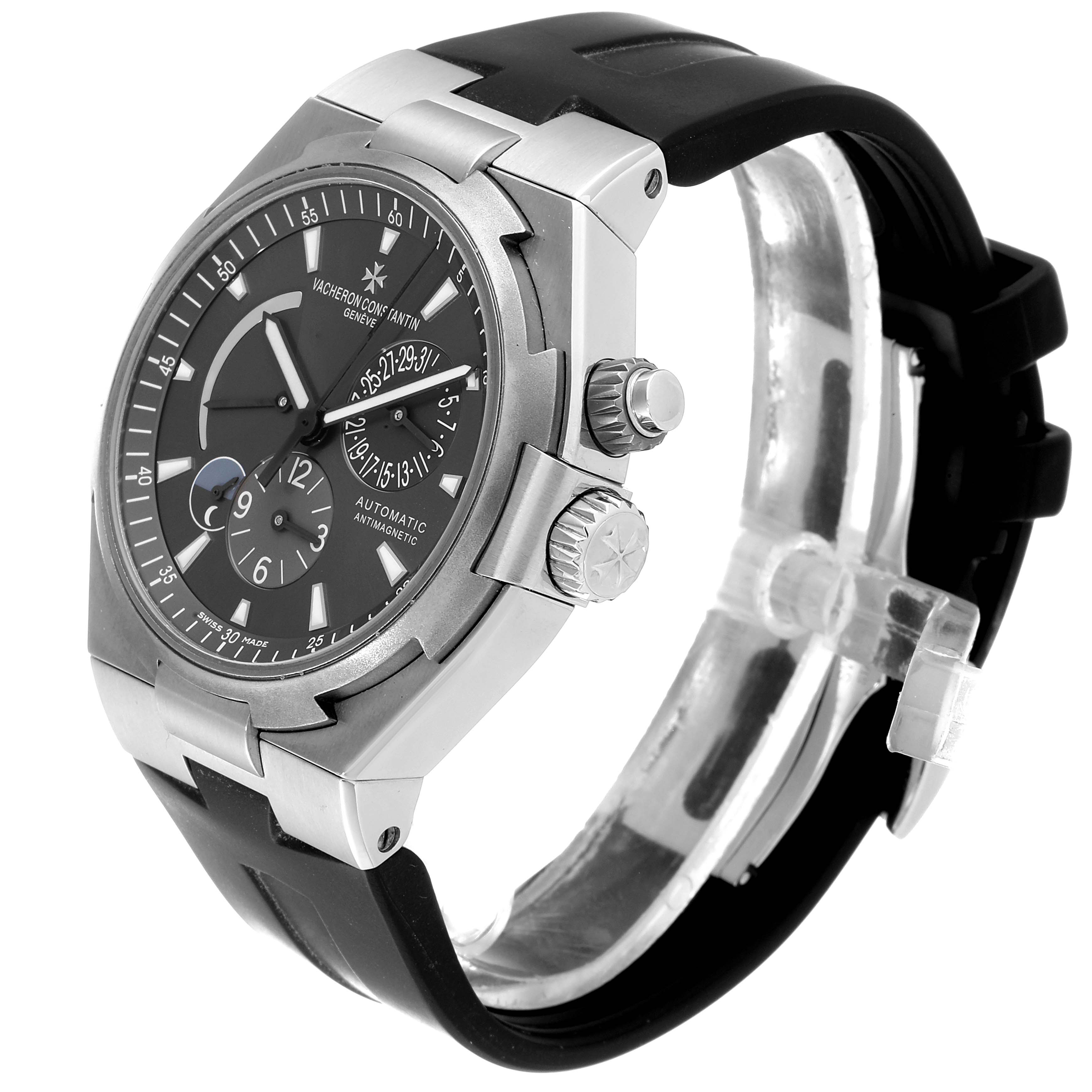 The Vacheron Constantin Overseas 47450/000W-9511 Men's Stainless Steel Black Dial 47450/000W-9511 Men's Stainless Steel Black Dial watch is shown at a three-quarter angle, highlighting the face, bezel, crown, and part of the strap.