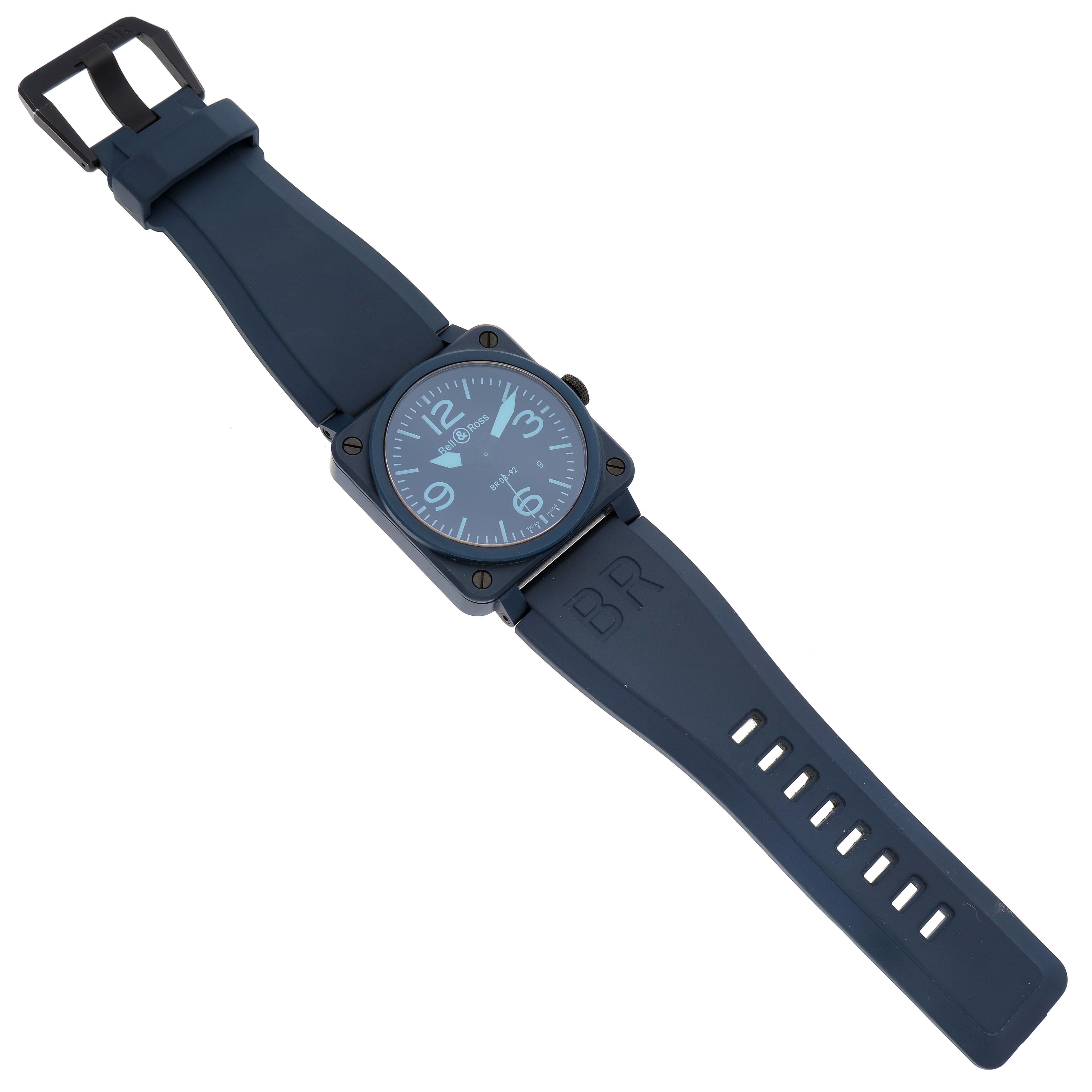 The Bell & Ross Chronograph watch is shown. The watch is laid flat, showing the front face, straps, and buckle.