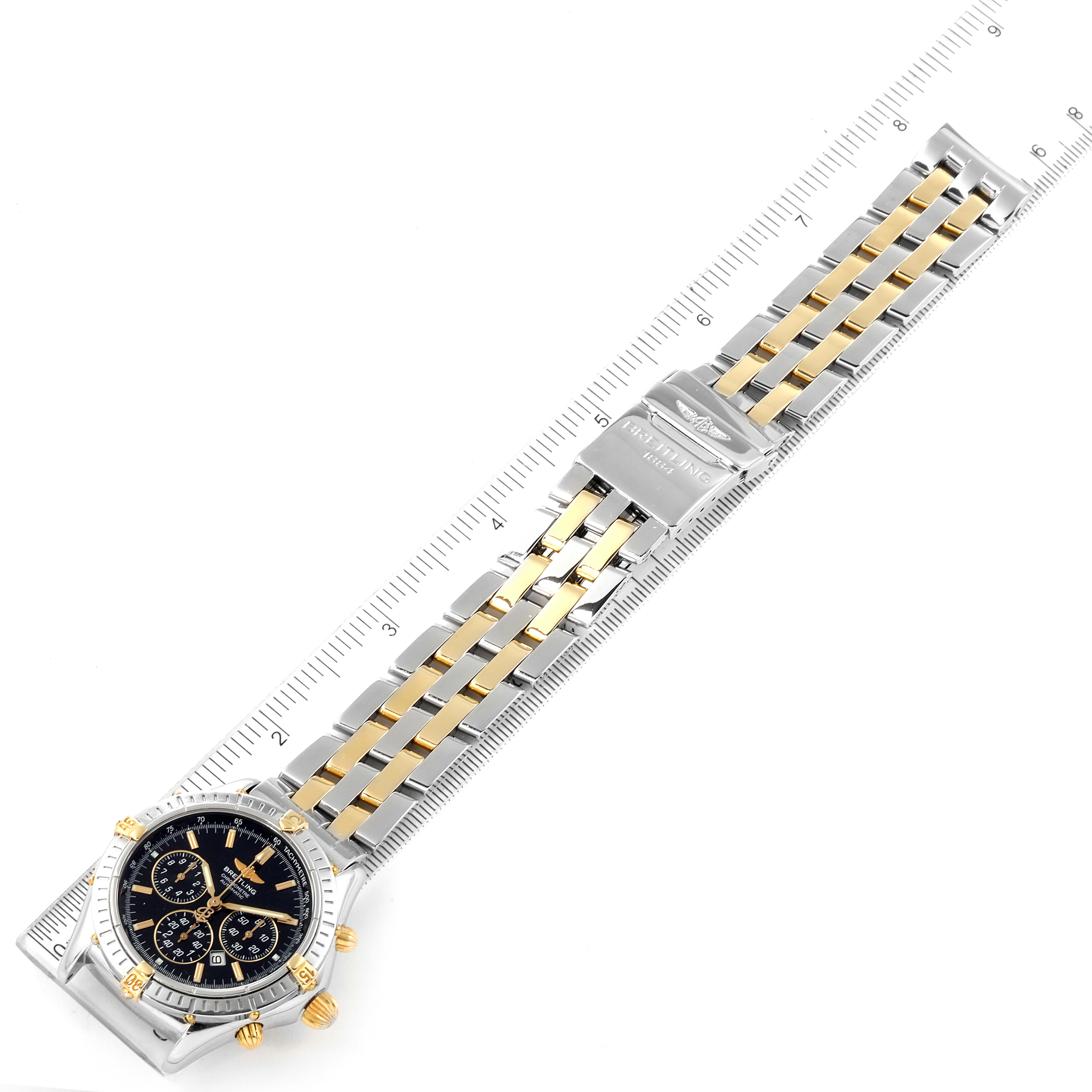 The Breitling Professional Series B35312 Men's Steel and Gold (two tone) Black Dial B35312 Men's Steel and Gold (two tone) Black Dial model watch is shown from an elevated angle, displaying the face, bezel, and two-tone metal bracelet with a clasp.
