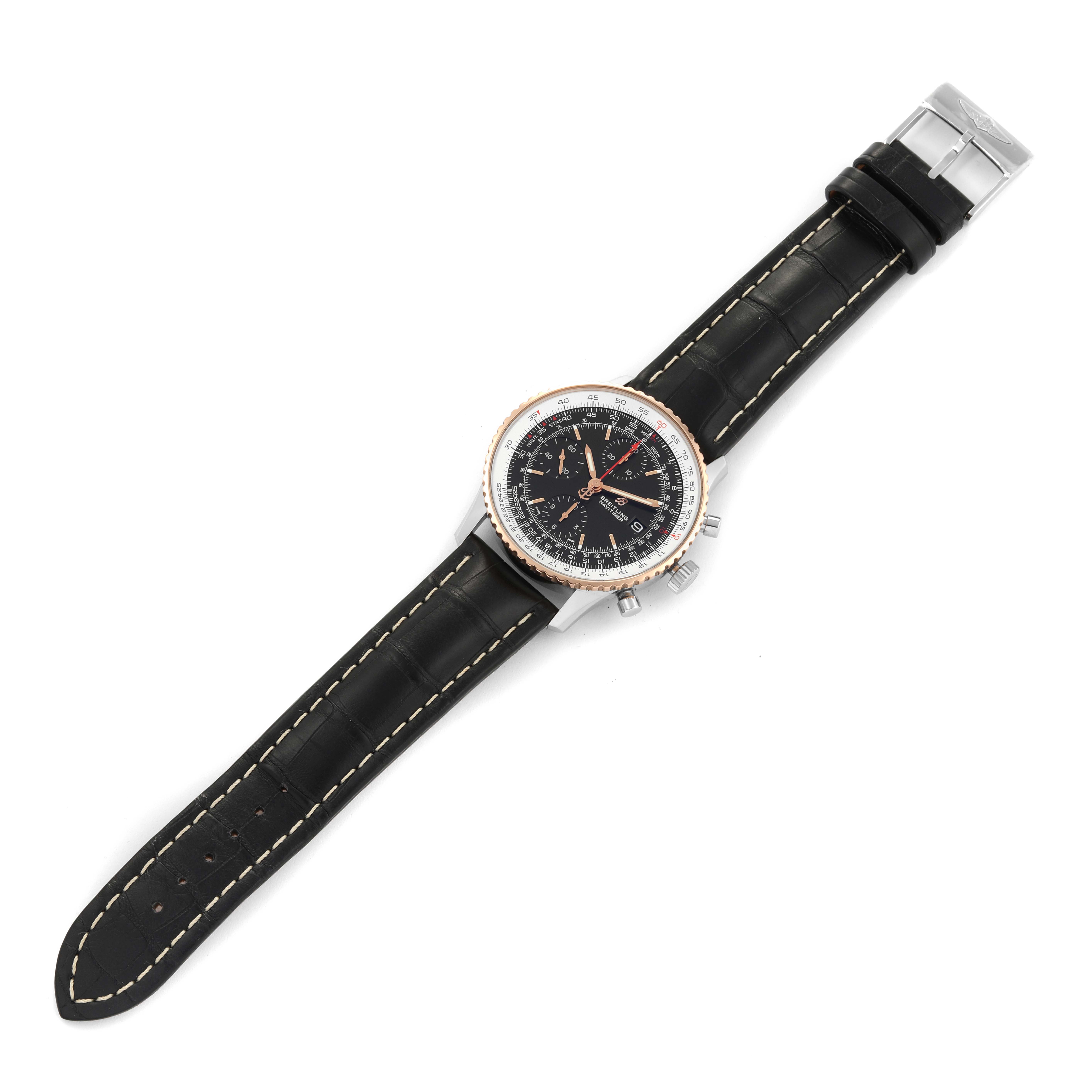 The Breitling Navitimer U13324 Men
s Steel and Gold (two tone) Black Dial U13324 Men
s Steel and Gold (two tone) Black Dial watch is shown from a top-down angle, displaying the full strap, face, and side buttons.