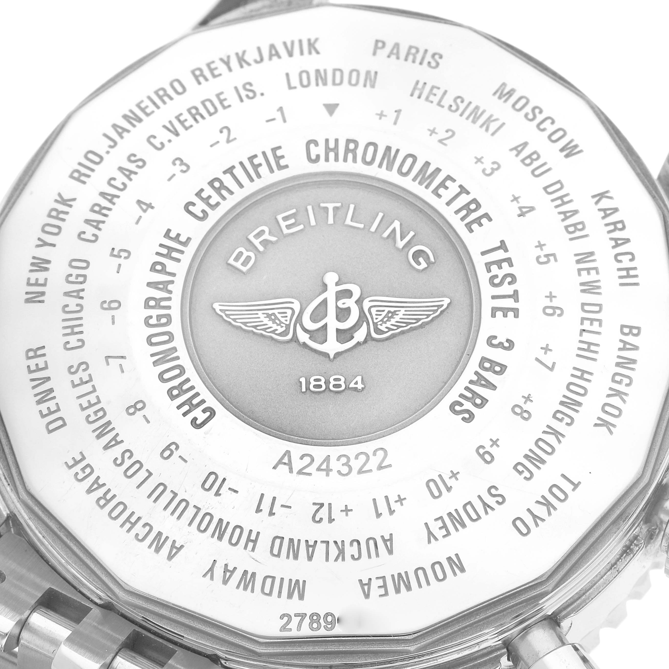 The image shows the back case of a Breitling Navitimer A24322 Men's Stainless Steel Black Dial A24322 Men's Stainless Steel Black Dial watch with time zone cities and model number A24322 engraved.