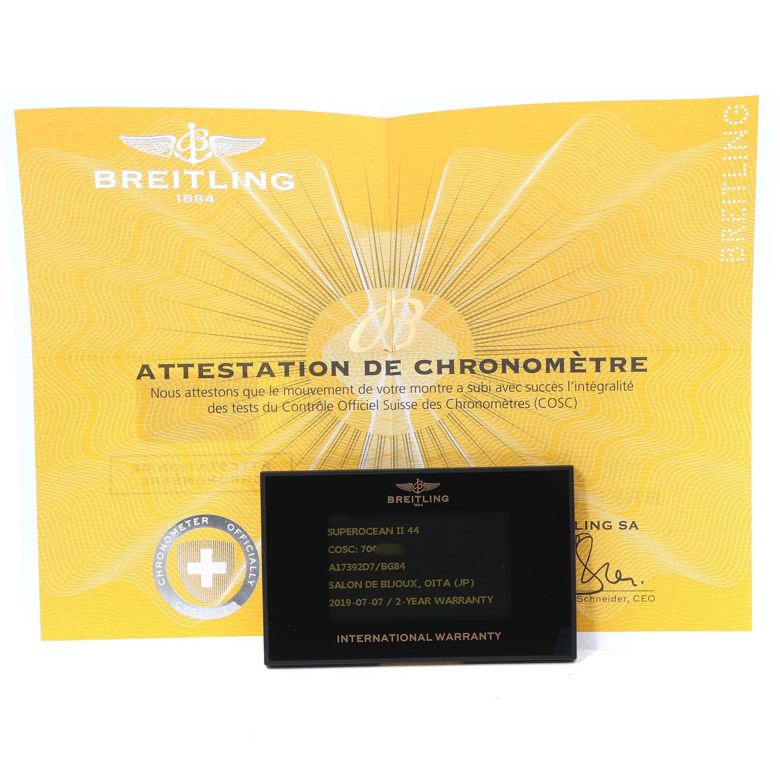 The image shows a Breitling Superocean A17392D8/C910 Men's Stainless Steel Black Dial A17392D8/C910 Men's Stainless Steel Black Dial model's Chronometer Certification and International Warranty card, displayed at a top-down angle.