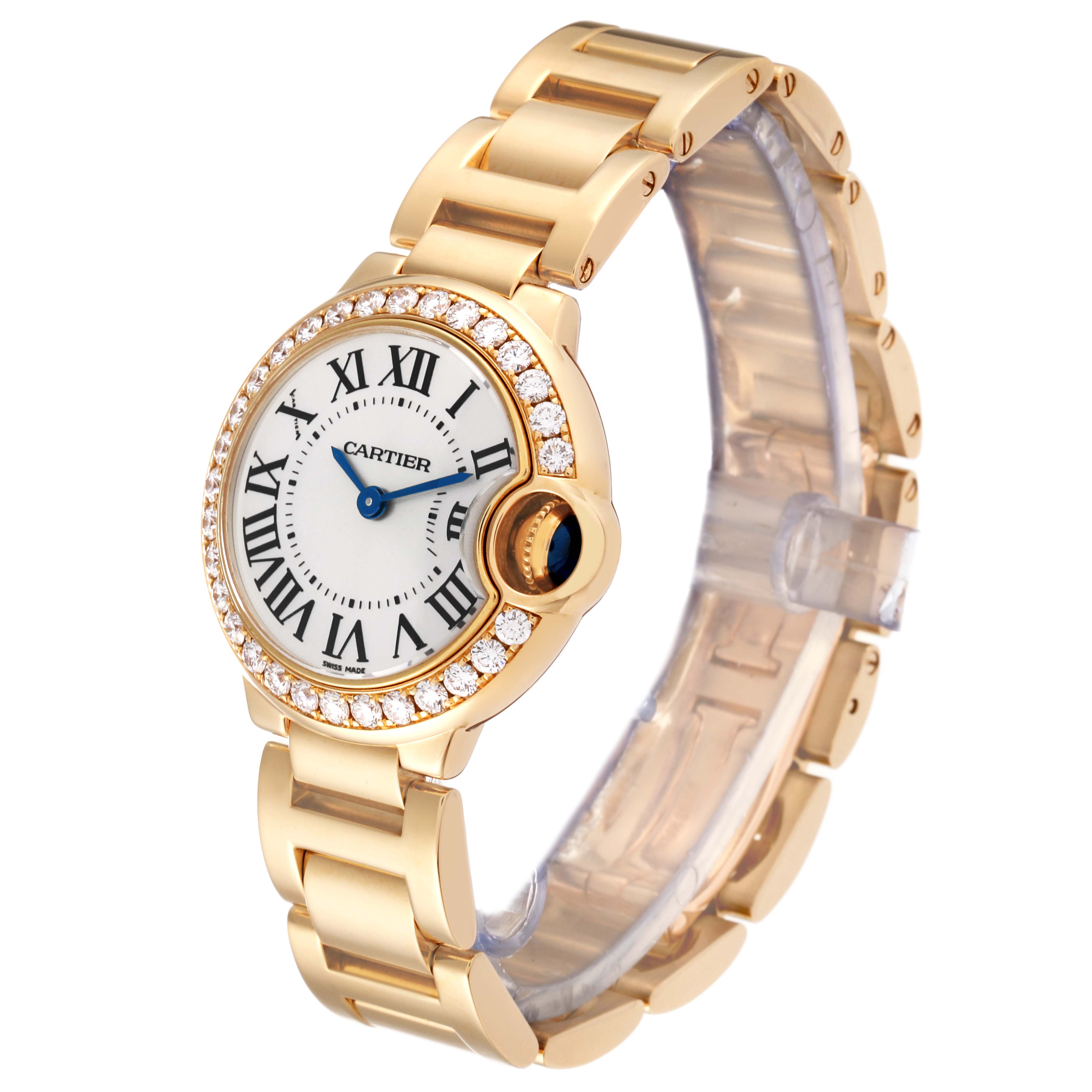 The Cartier Ballon Bleu WE9001Z3 Women's Yellow Gold Silver Dial WE9001Z3 Women's Yellow Gold Silver Dial watch is shown at a three-quarter angle, highlighting its face, bracelet, and diamond bezel.