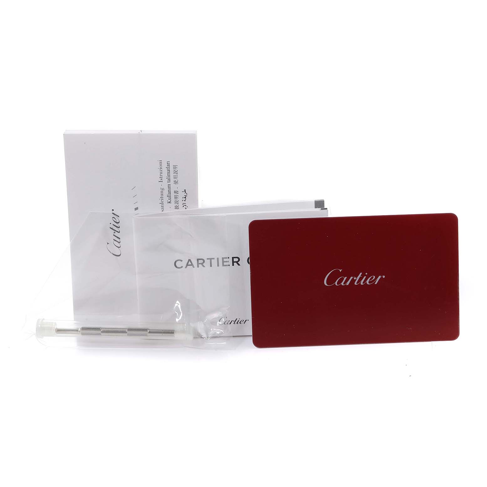 This image shows accessories for the Cartier Santos WSSA0017 Men
s Stainless Steel Silver Dial WSSA0017 Men
s Stainless Steel Silver Dial model, including booklets, a red card, and a link.