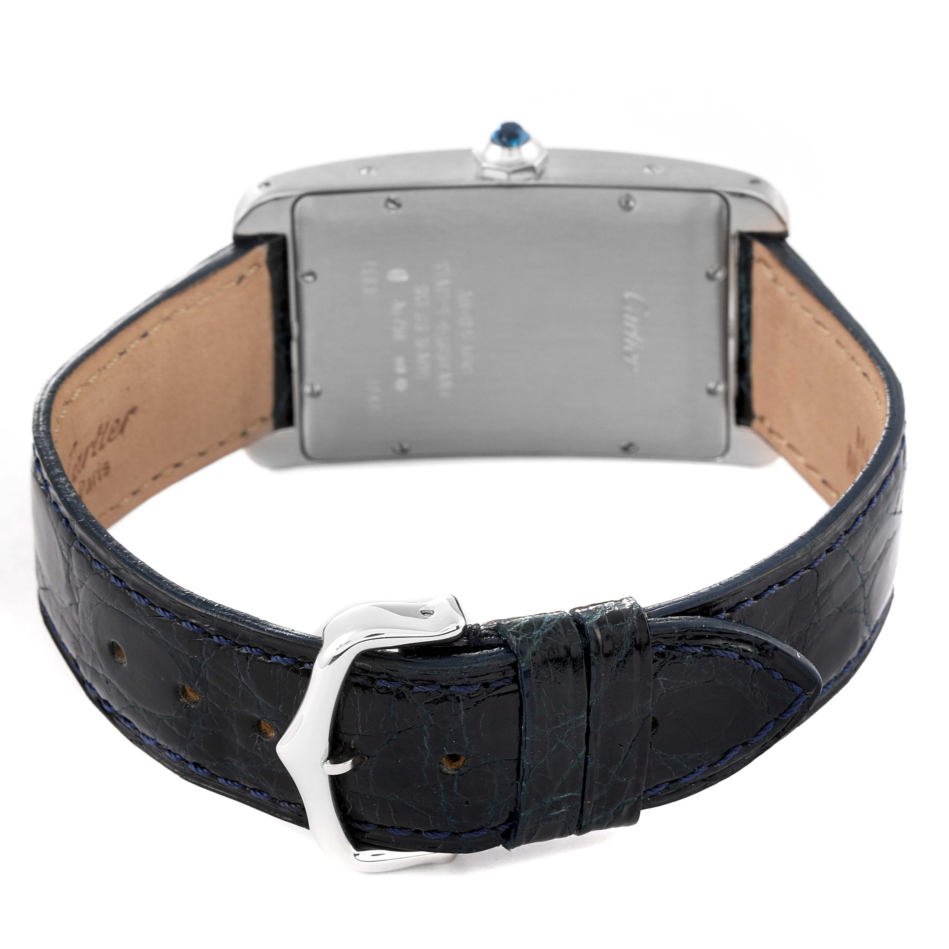 The image shows the back view of a Cartier Tank Americaine W2603256 Men's White Gold Silver Dial W2603256 Men's White Gold Silver Dial watch, highlighting the clasp, leather strap, and case back.