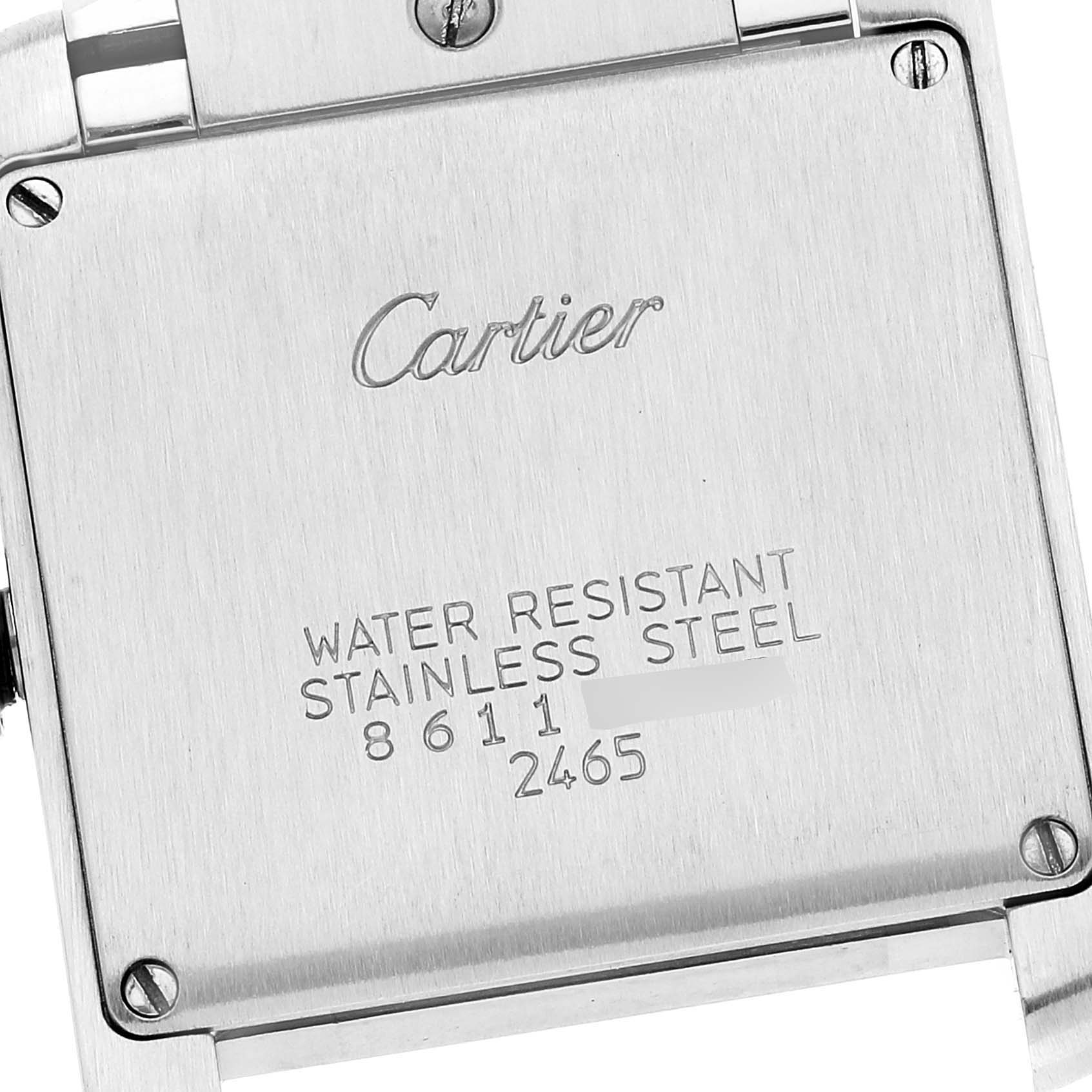 This image shows the back of a Cartier Tank Francaise W51012Q4 Women's Steel and Gold (two tone) Silver Dial W51012Q4 Women's Steel and Gold (two tone) Silver Dial watch, displaying its serial number and material information.