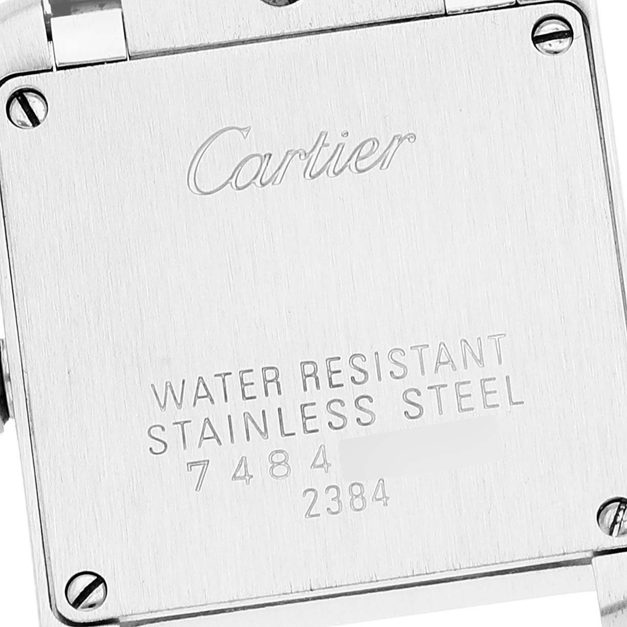 The image shows the back of a stainless steel Cartier Tank Francaise W51008Q3 Women's Stainless Steel Silver Dial W51008Q3 Women's Stainless Steel Silver Dial watch with inscriptions detailing its water resistance.