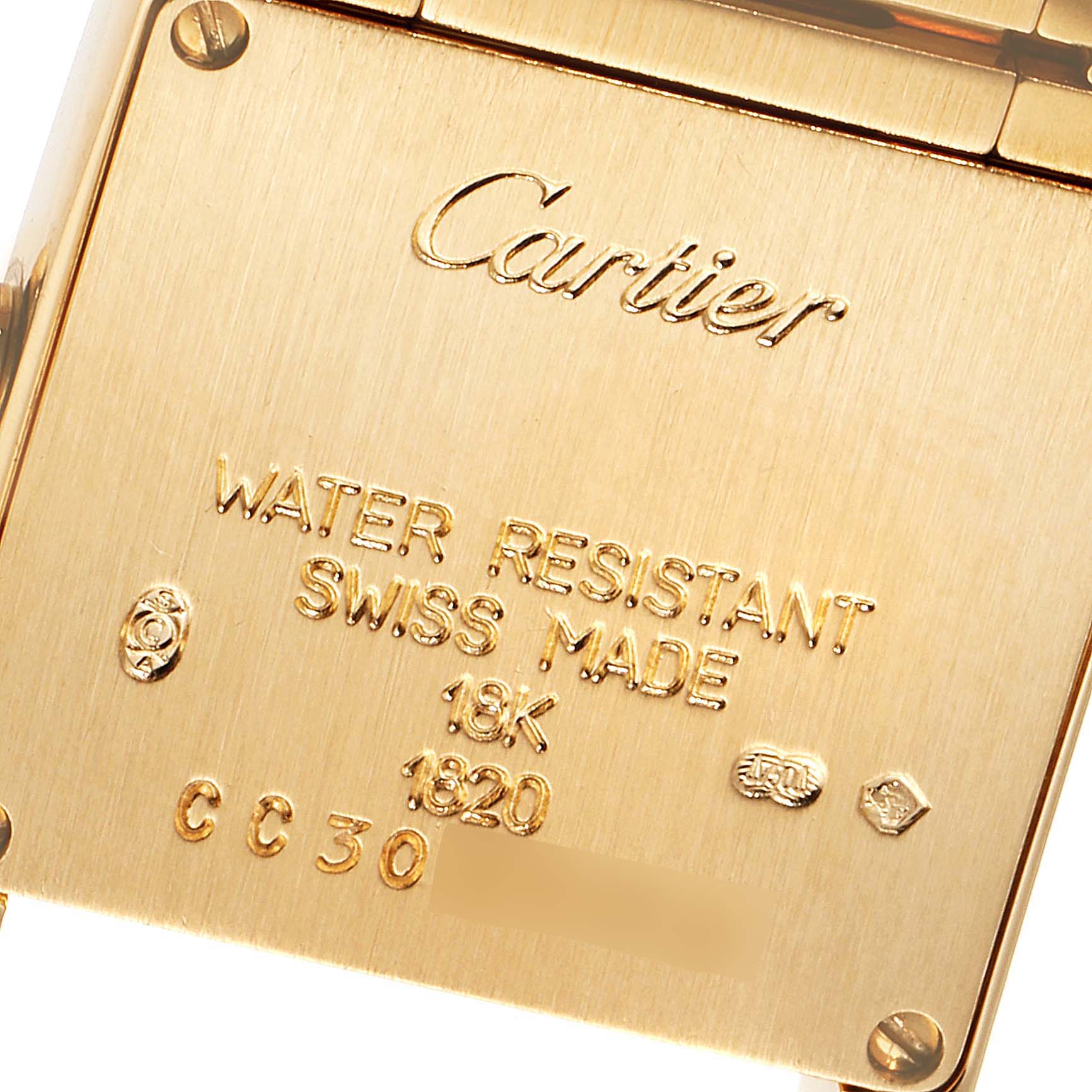 The image shows the back cover of a Cartier Tank Francaise W50002N2 Women
s Yellow Gold Silver Dial W50002N2 Women
s Yellow Gold Silver Dial watch, highlighting its engravings and gold material.