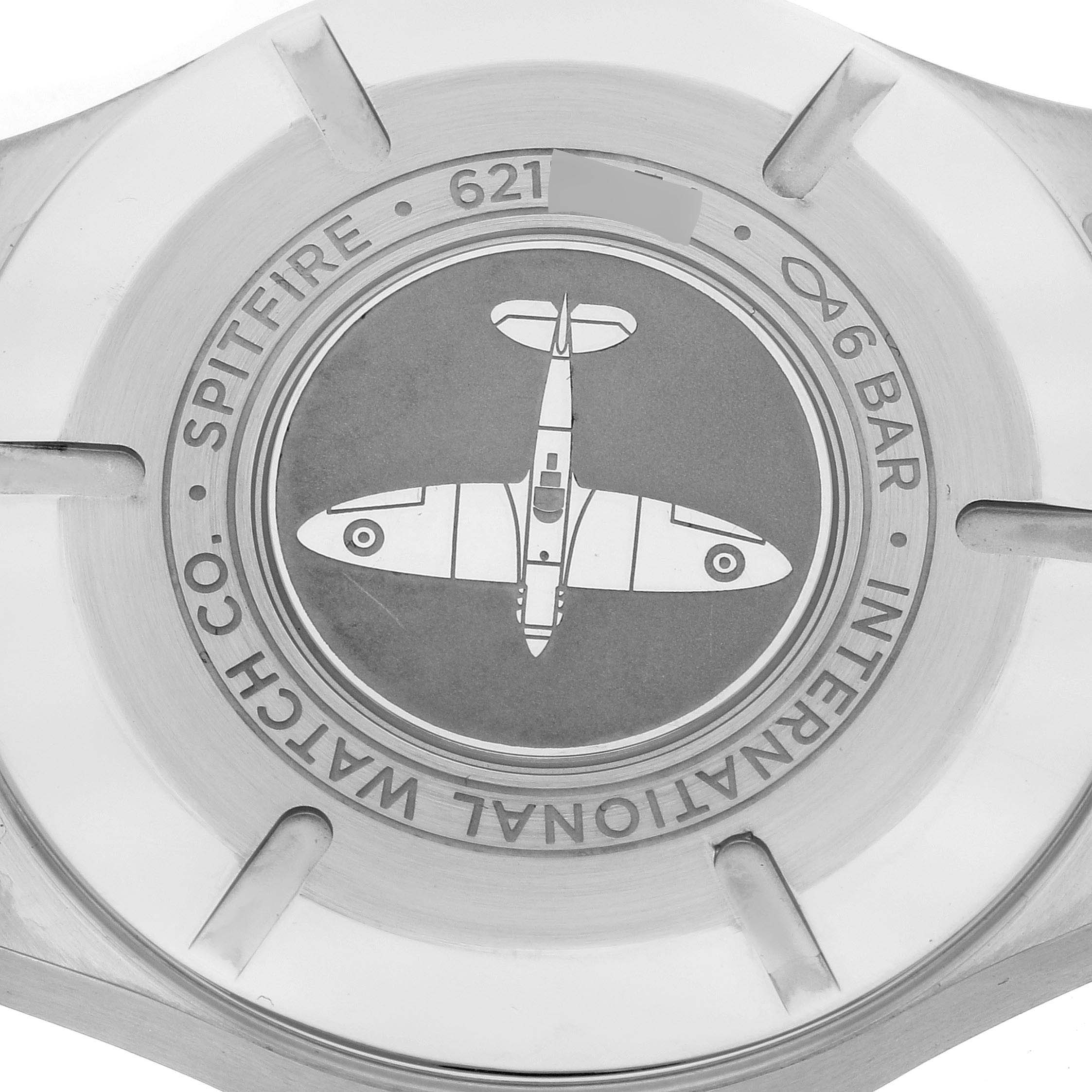 This image shows the case back of the IWC Pilot IW326801 Men's Stainless Steel Black Dial IW326801 Men's Stainless Steel Black Dial Spitfire watch, featuring an engraved Spitfire airplane design.
