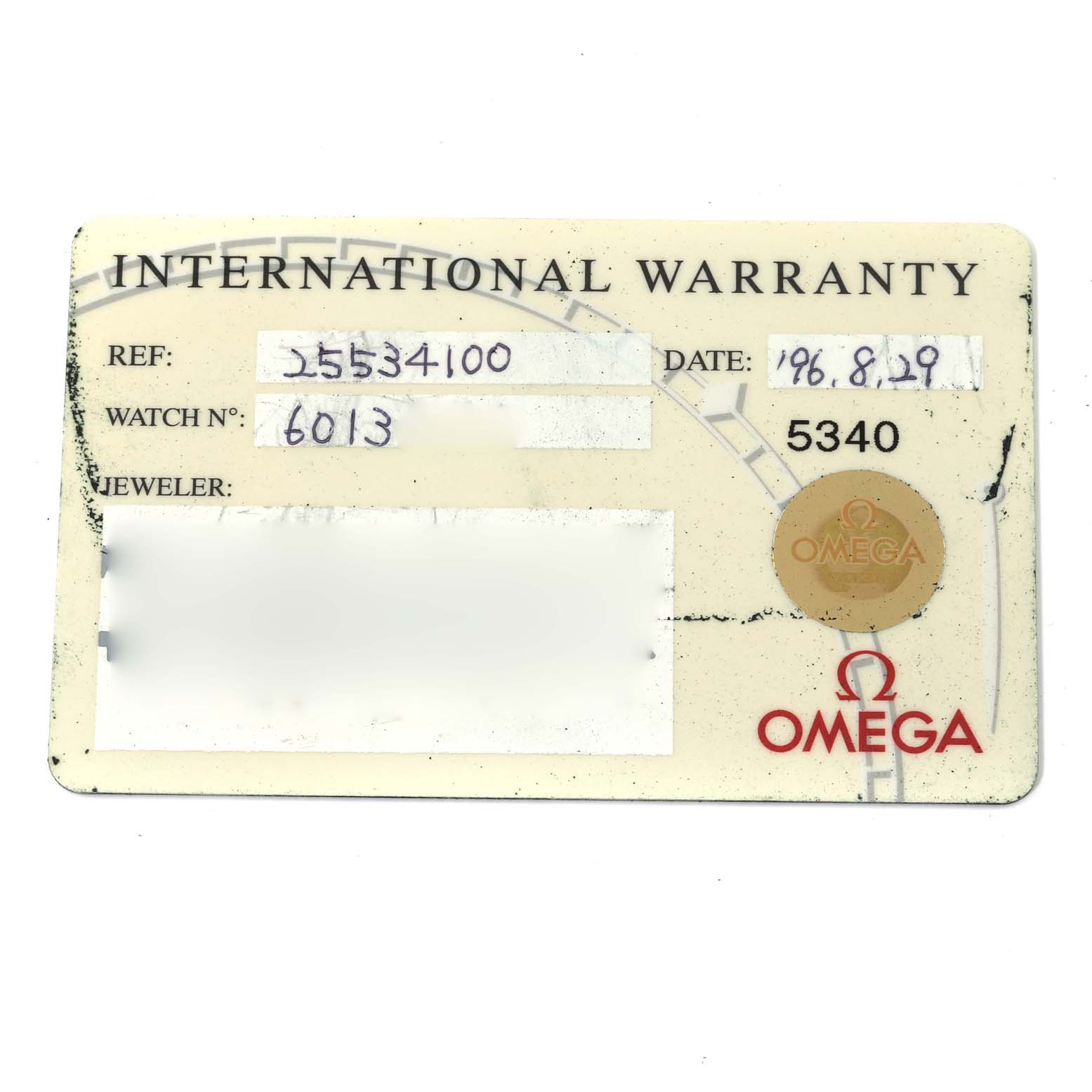 The image shows an Omega Seamaster 2553.41.00 Men's Stainless Steel Green Dial 2553.41.00 Men's Stainless Steel Green Dial International Warranty card with details like reference number, watch number, date, and jeweler.