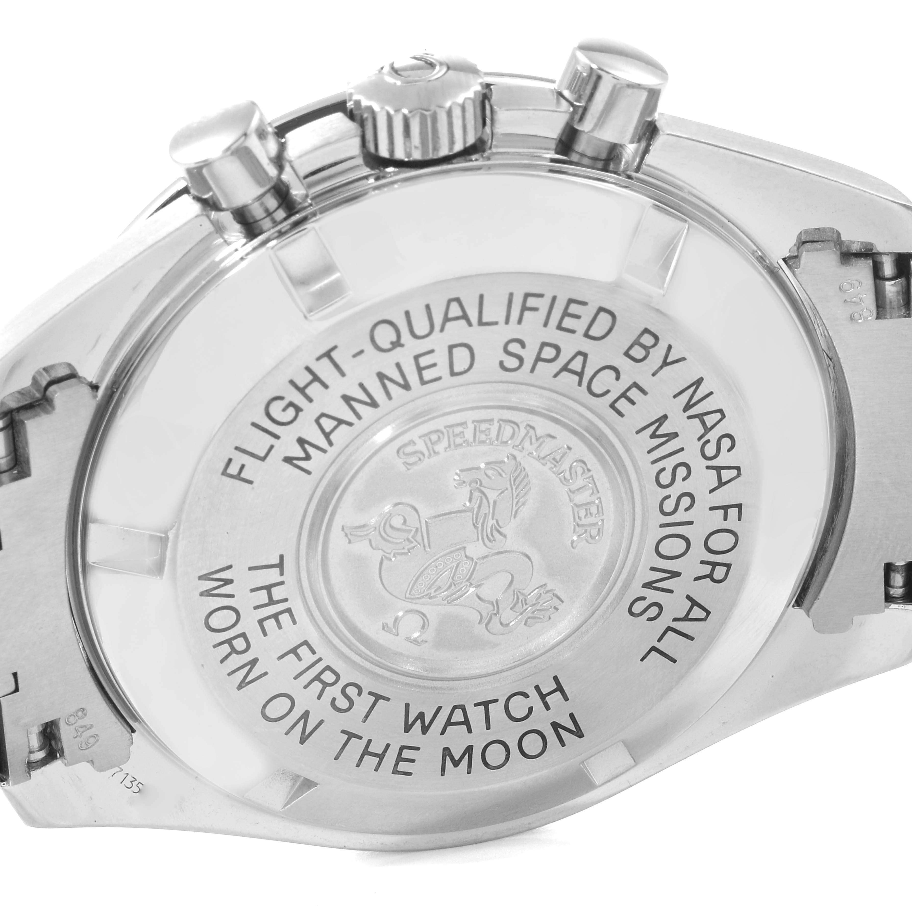 The image shows the case back and chronograph pushers of an Omega Speedmaster 3570.50.00 Men's Stainless Steel Black Dial 3570.50.00 Men's Stainless Steel Black Dial, highlighting its engraved text and emblem.