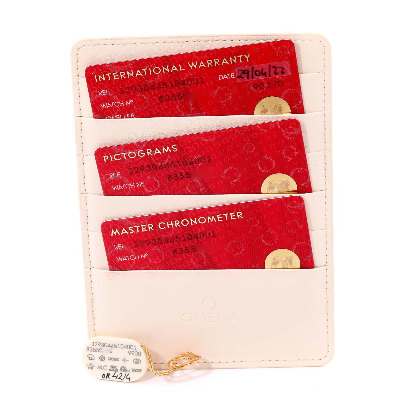 This image shows warranty cards and tags for an Omega Speedmaster 329.30.44.51.04.001 Men
s Stainless Steel Silver Dial 329.30.44.51.04.001 Men
s Stainless Steel Silver Dial watch, displayed vertically in a cardholder.