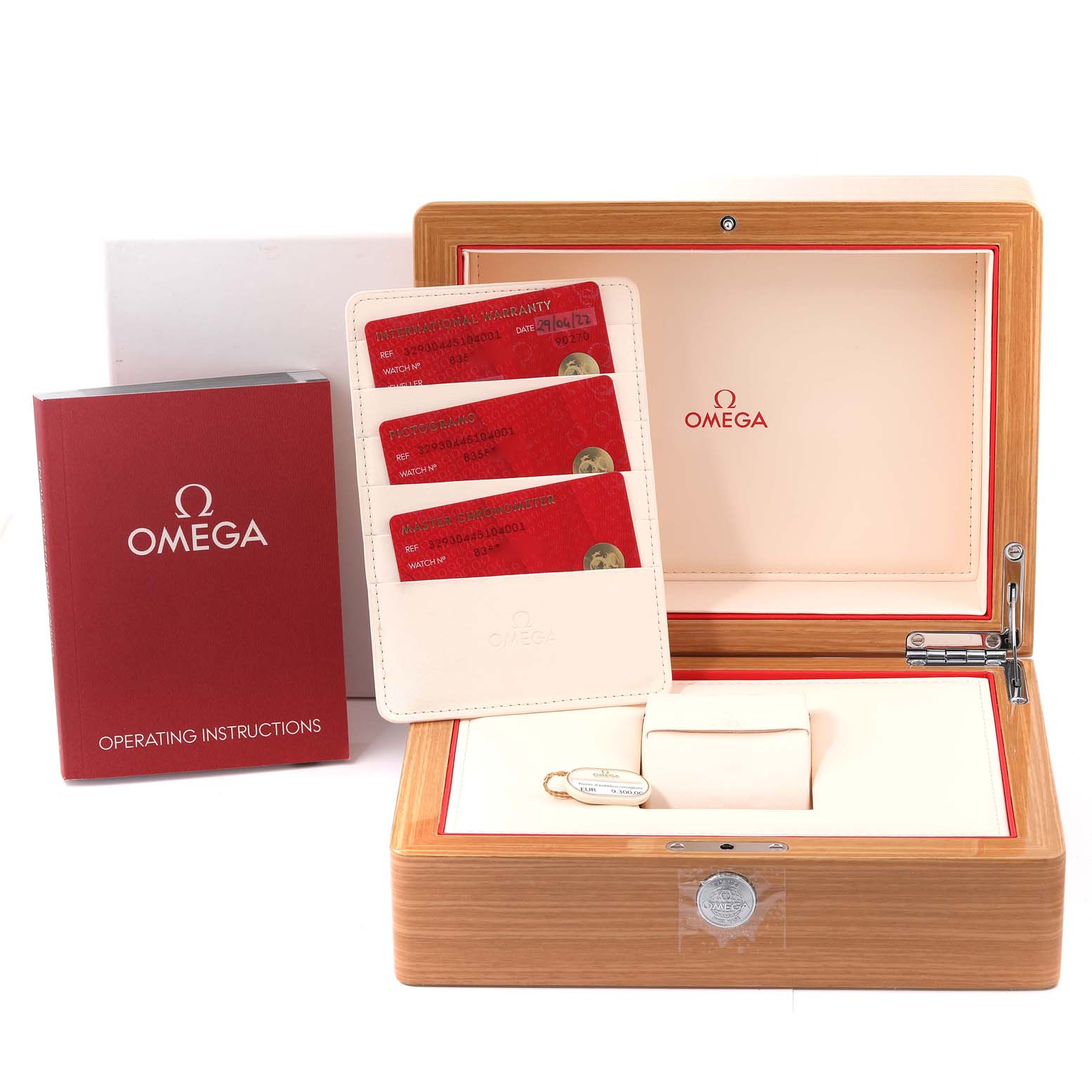 The image shows an Omega Speedmaster 329.30.44.51.04.001 Men
s Stainless Steel Silver Dial 329.30.44.51.04.001 Men
s Stainless Steel Silver Dial watch box set, including an open wooden box, operating instructions, and warranty cards.