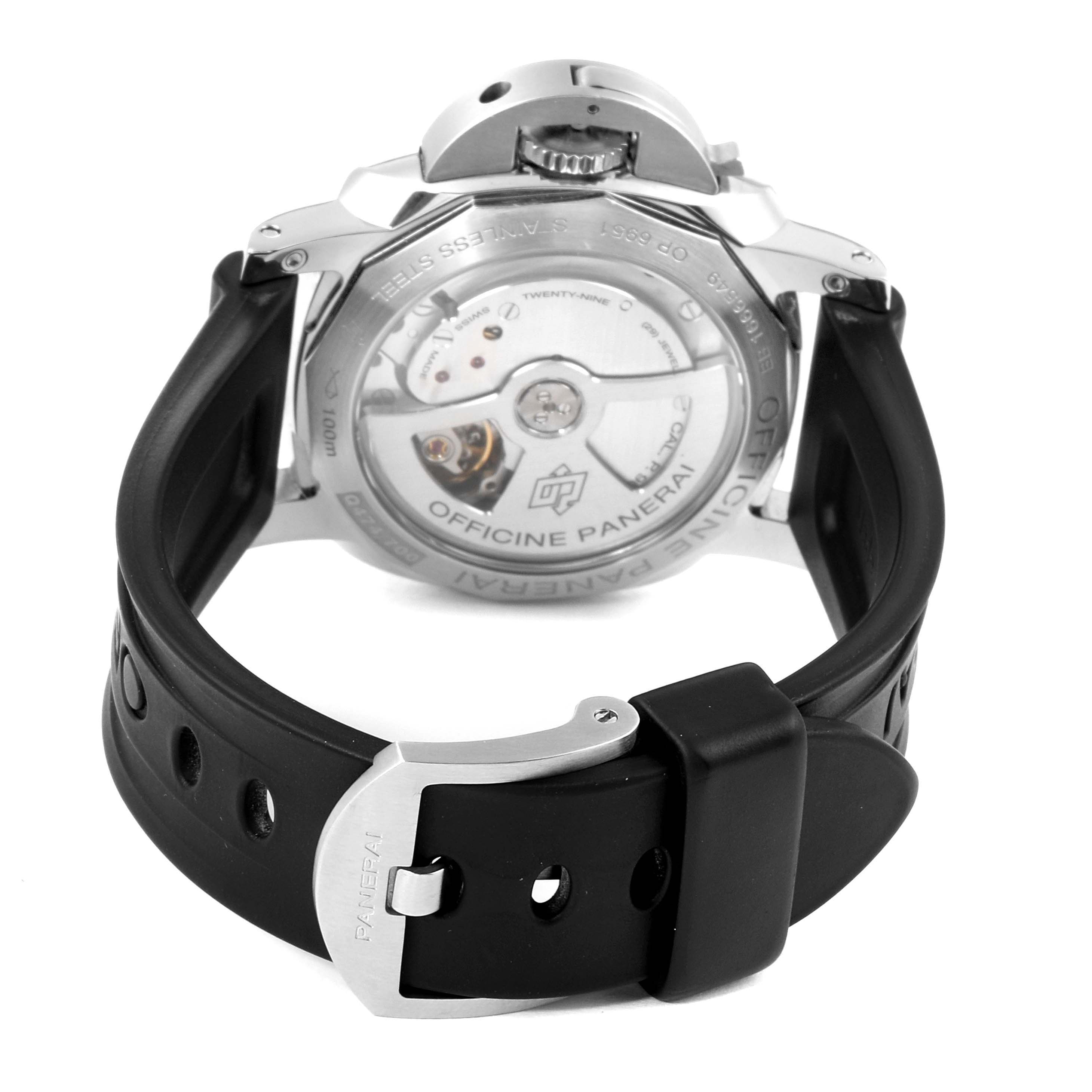 The image shows the back view of a Panerai Luminor PAM00537 Men
s Stainless Steel Black Dial PAM00537 Men
s Stainless Steel Black Dial watch, revealing the movement and the black rubber strap with a stainless buckle.