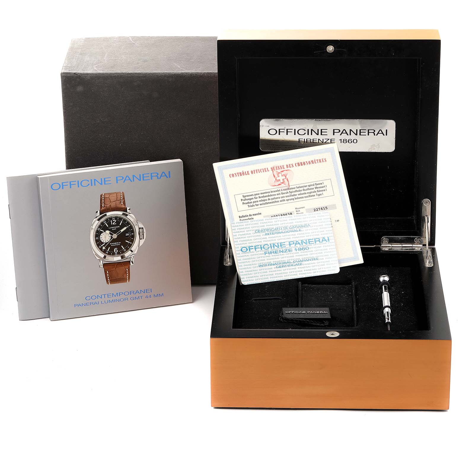 The image shows an open Panerai Luminor PAM00088 Men
s Stainless Steel Black Dial PAM00088 Men
s Stainless Steel Black Dial watch box with manuals, certificates, and watch tools included.