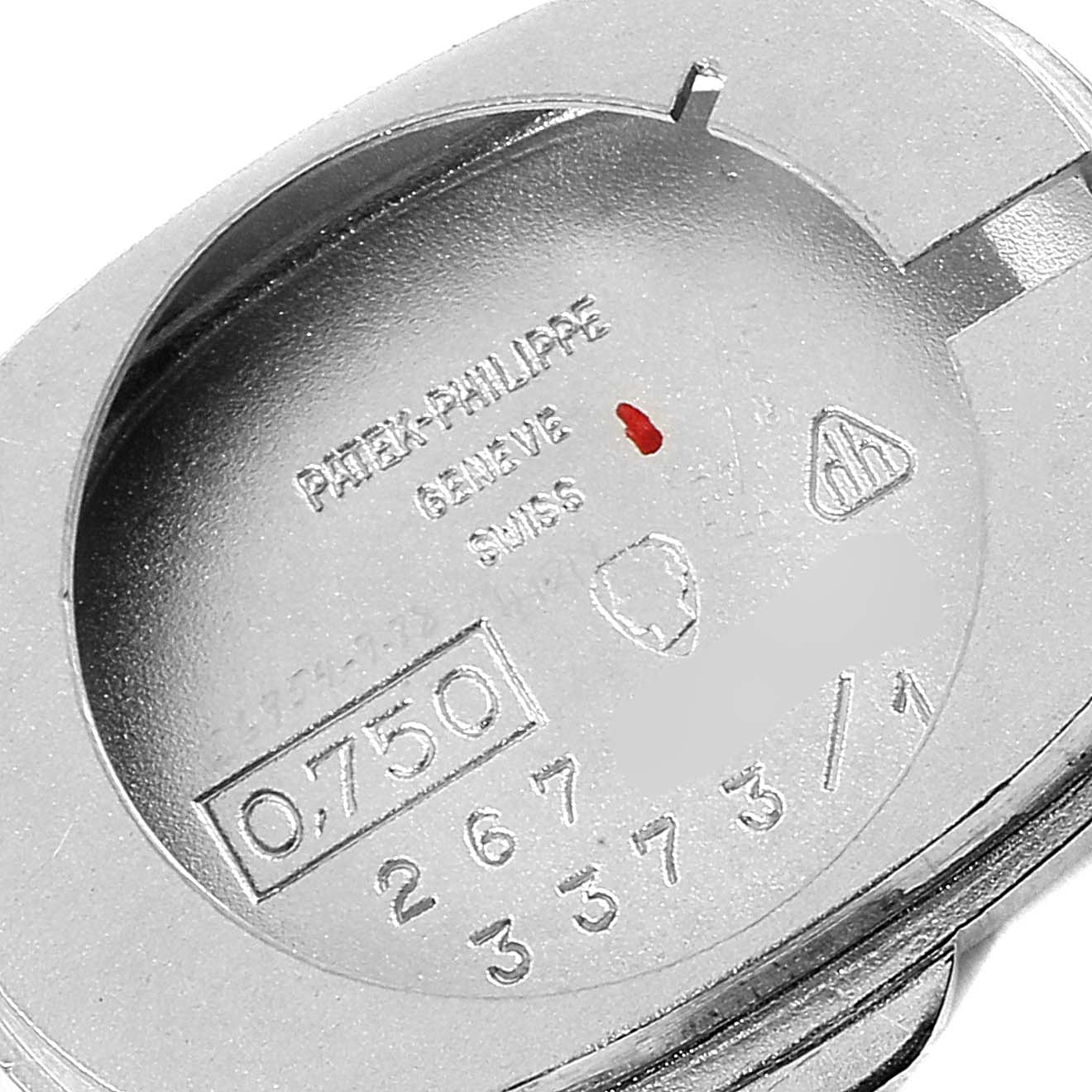 This image shows the inner caseback of a Vintage Patek Philippe watch, featuring various inscriptions and hallmarks.