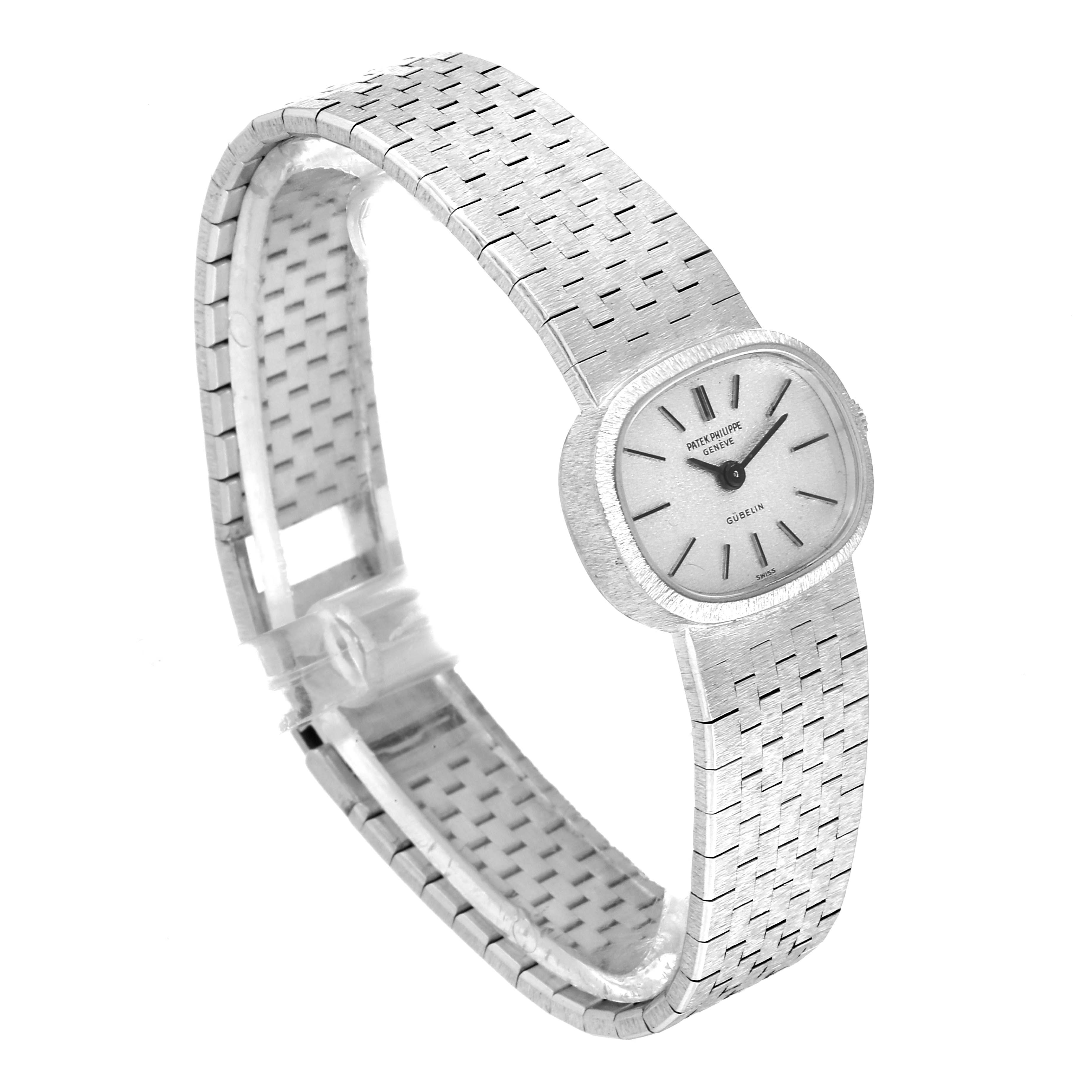 The image shows a side angle of the Vintage Patek Philippe watch, displaying its face, integrated bracelet, and clasp.