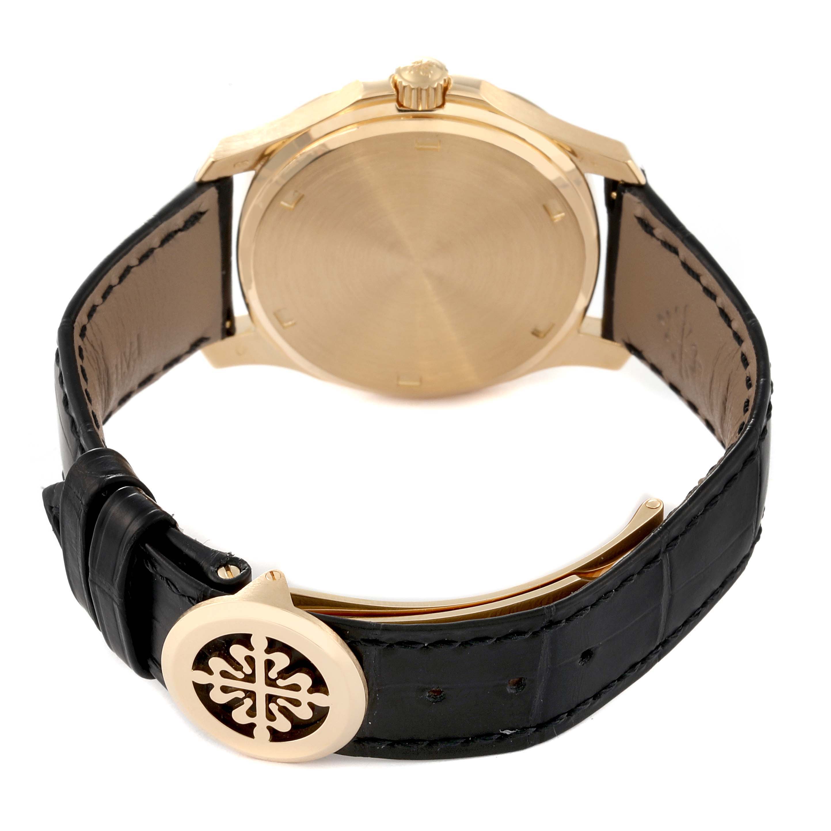 This image shows the back case and leather strap of a Patek Philippe Aquanaut 5060J Men's Yellow Gold Black Dial 5060J Men's Yellow Gold Black Dial watch at a rear angle.