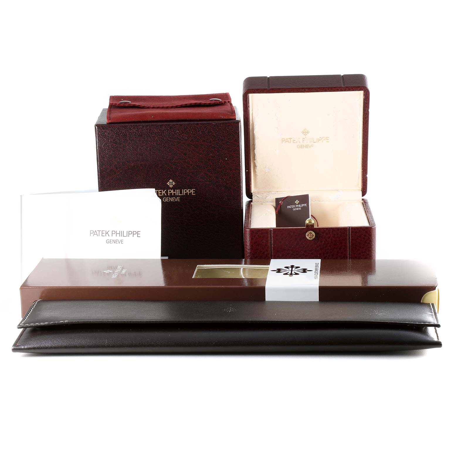 The image shows the packaging, manuals, and accessories of a Patek Philippe Aquanaut 5060J Men's Yellow Gold Black Dial 5060J Men's Yellow Gold Black Dial watch from a front angle.