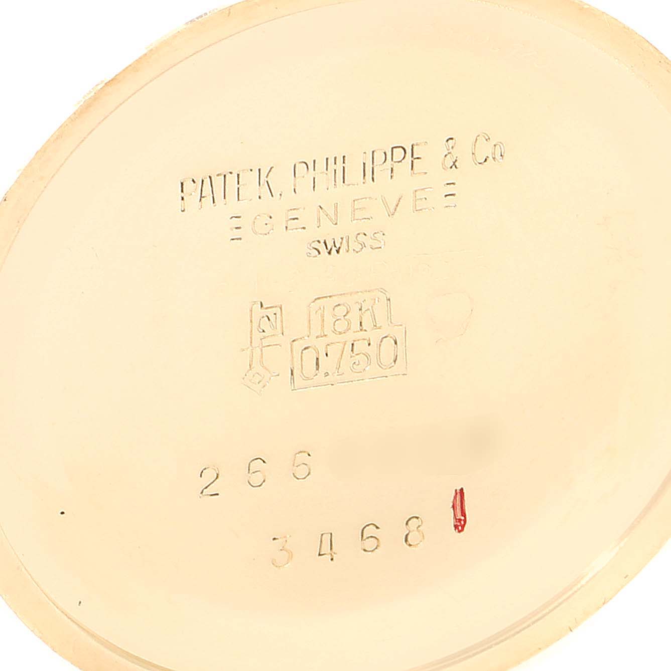 The image shows the inside case back of a Vintage Patek Philippe watch, displaying hallmarks and engraved text.