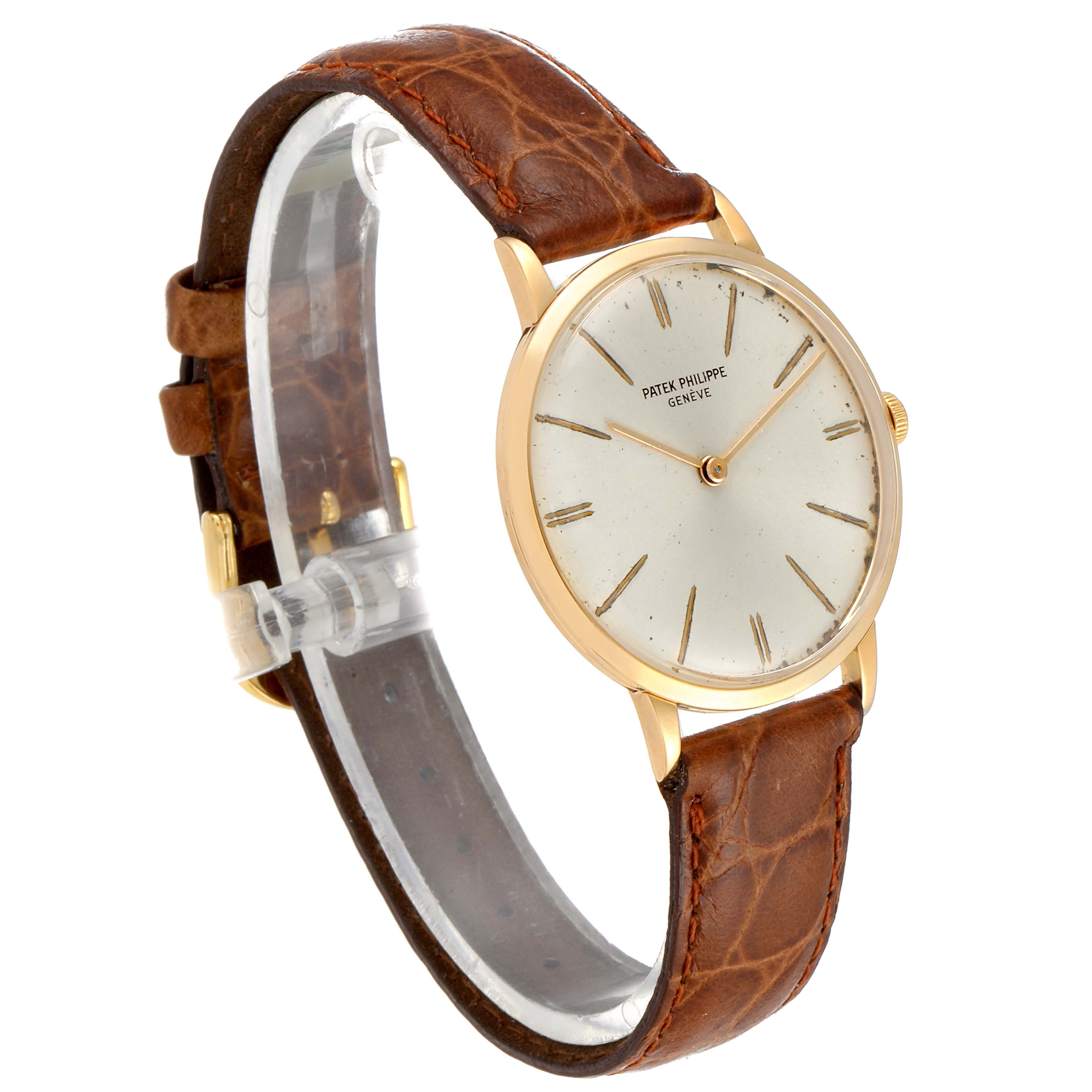The image shows a Patek Philippe Vintage model watch from an oblique front angle, highlighting the face, case, and brown leather strap.