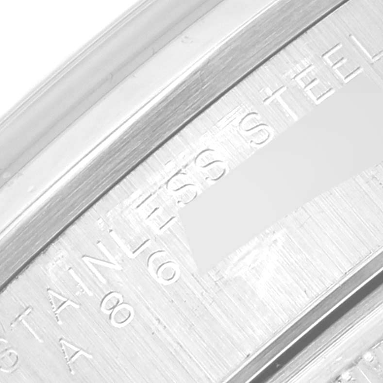 This image shows a close-up angle of the metal casing of a Rolex Air-King 14000 Men's Stainless Steel Black Dial 14000 Men's Stainless Steel Black Dial watch, highlighting the "STAINLESS STEEL" engraving.