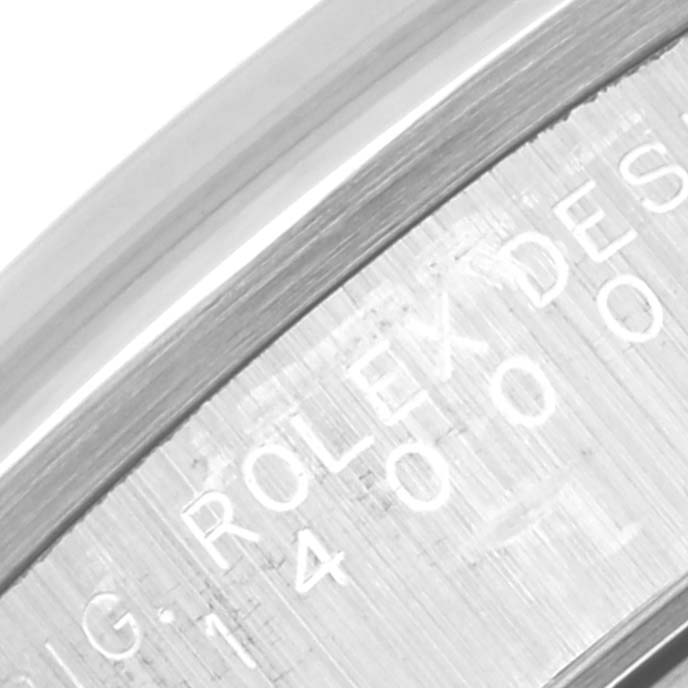 This image shows an angled close-up of the engraved side of the bezel on a Rolex Air-King 14000 Men's Stainless Steel Black Dial 14000 Men's Stainless Steel Black Dial watch.