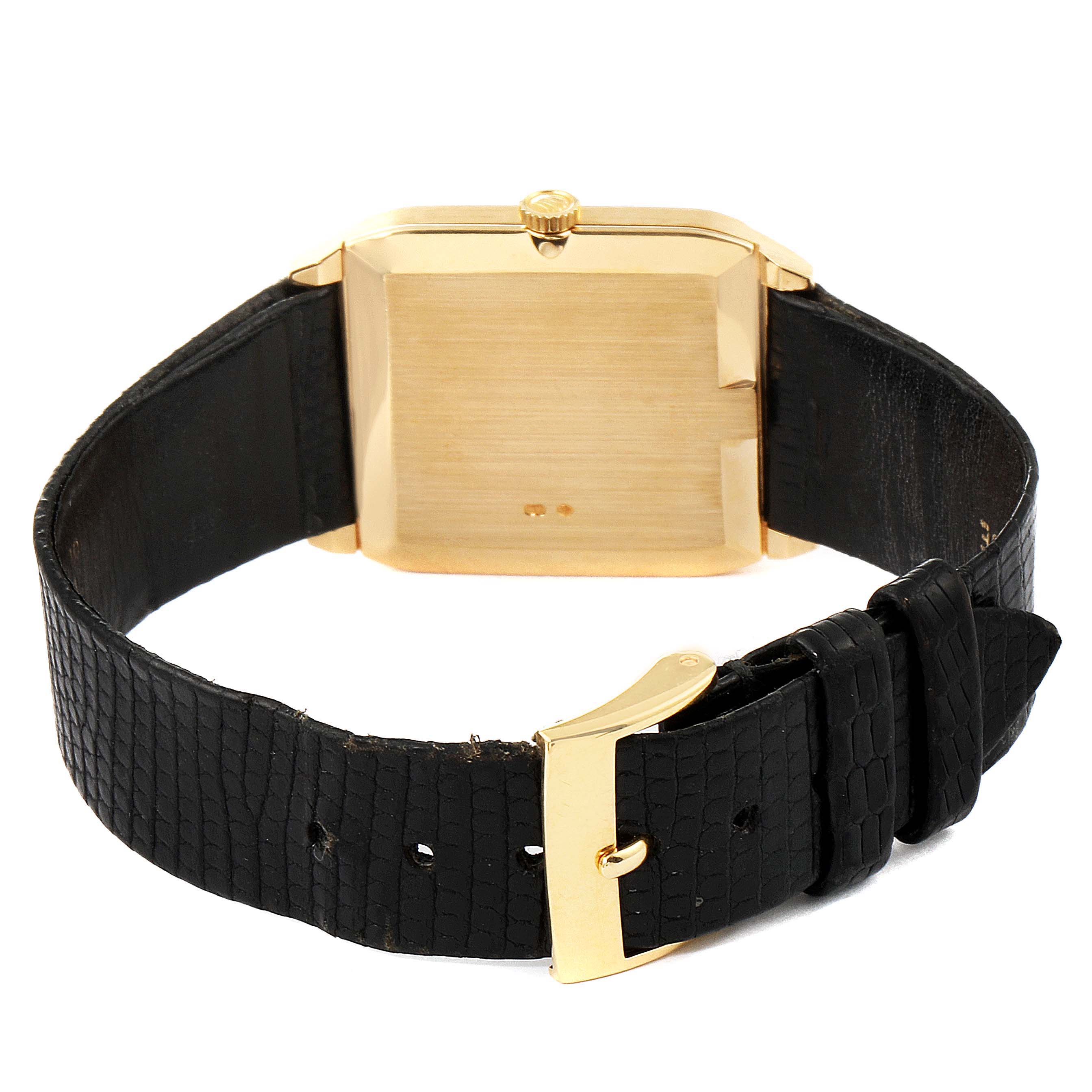 This image shows the back view of a Rolex Cellini 4135 Men's Yellow Gold Champagne Dial 4135 Men's Yellow Gold Champagne Dial watch, highlighting its leather strap and gold buckle.